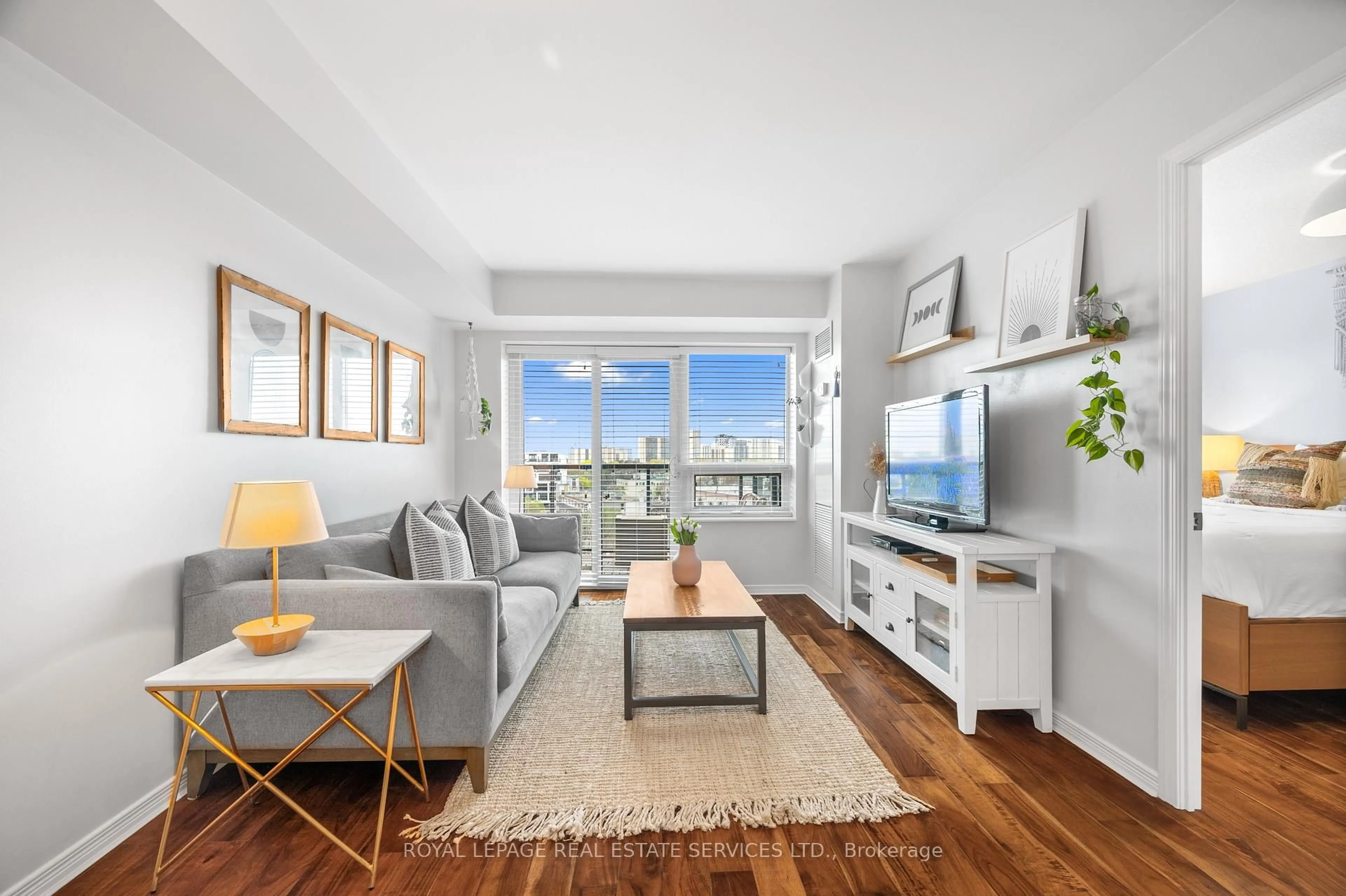 Living room with furniture, wood/laminate floor for 61 Heintzman St #812, Toronto Ontario M6P 5A2