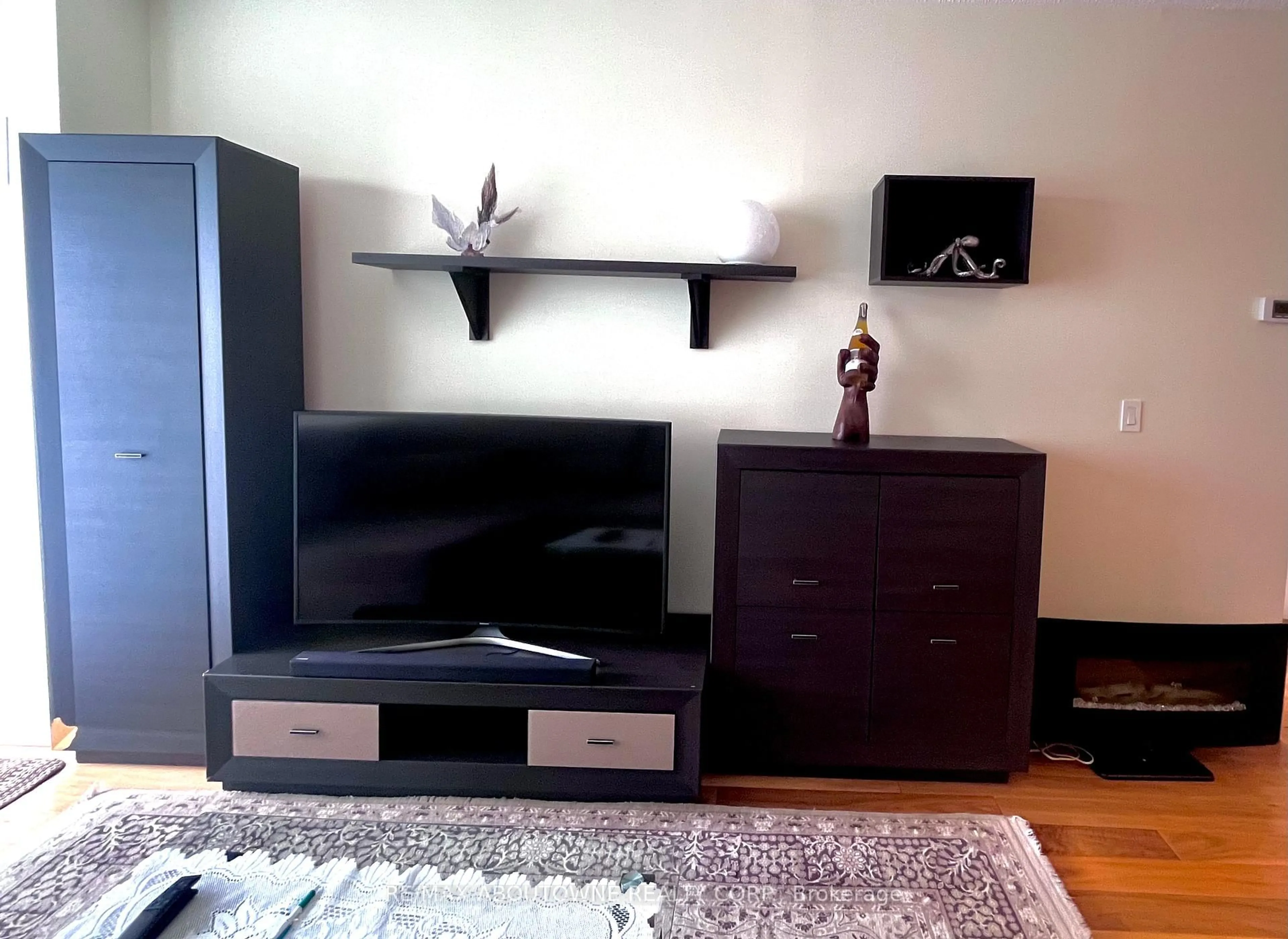 Living room with furniture, wood/laminate floor for 1359 Rathburn Rd #1207, Mississauga Ontario L4W 5P7