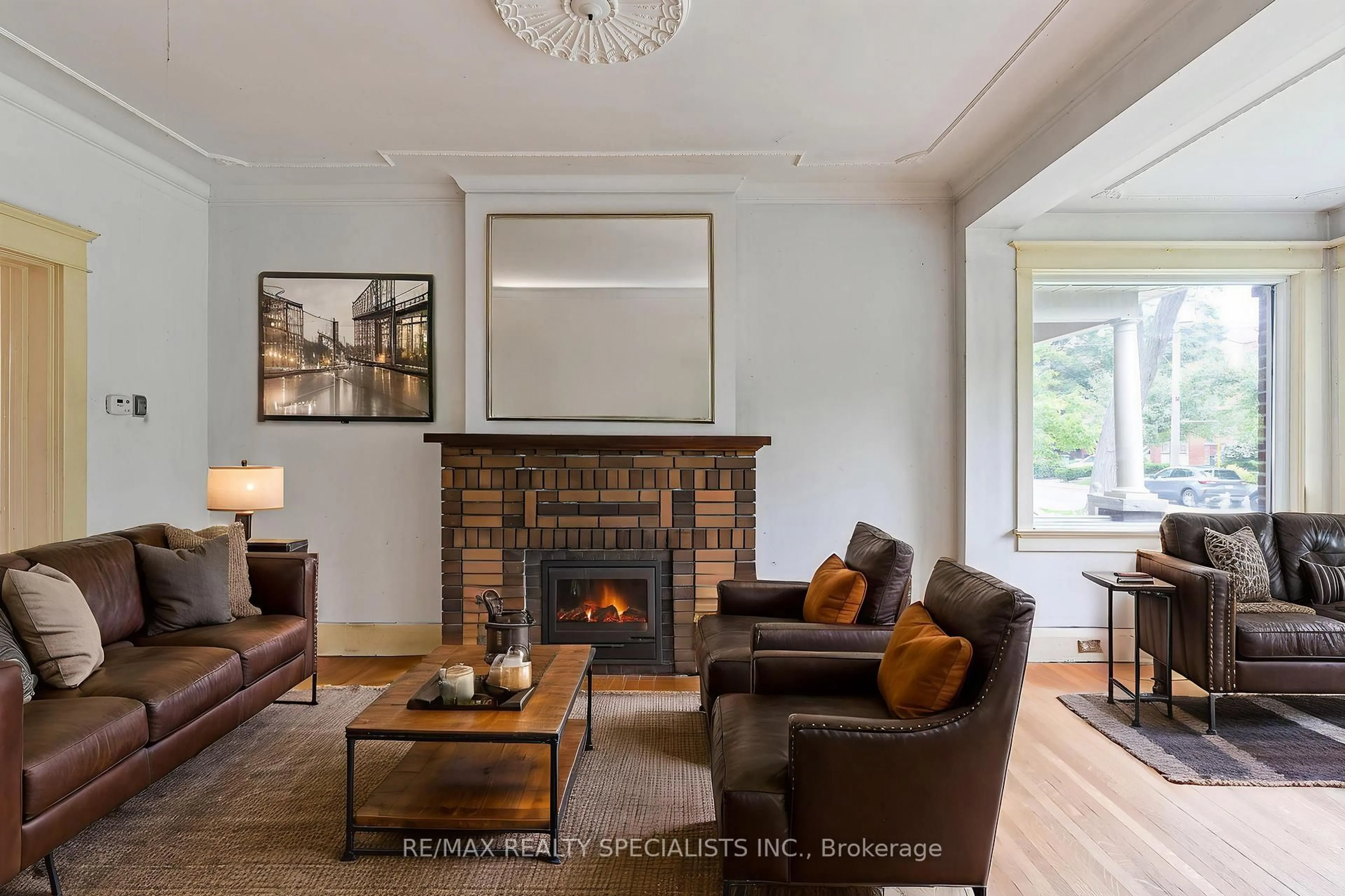 Living room with furniture, wood/laminate floor for 35 Glenlake Ave, Toronto Ontario M6P 1E2