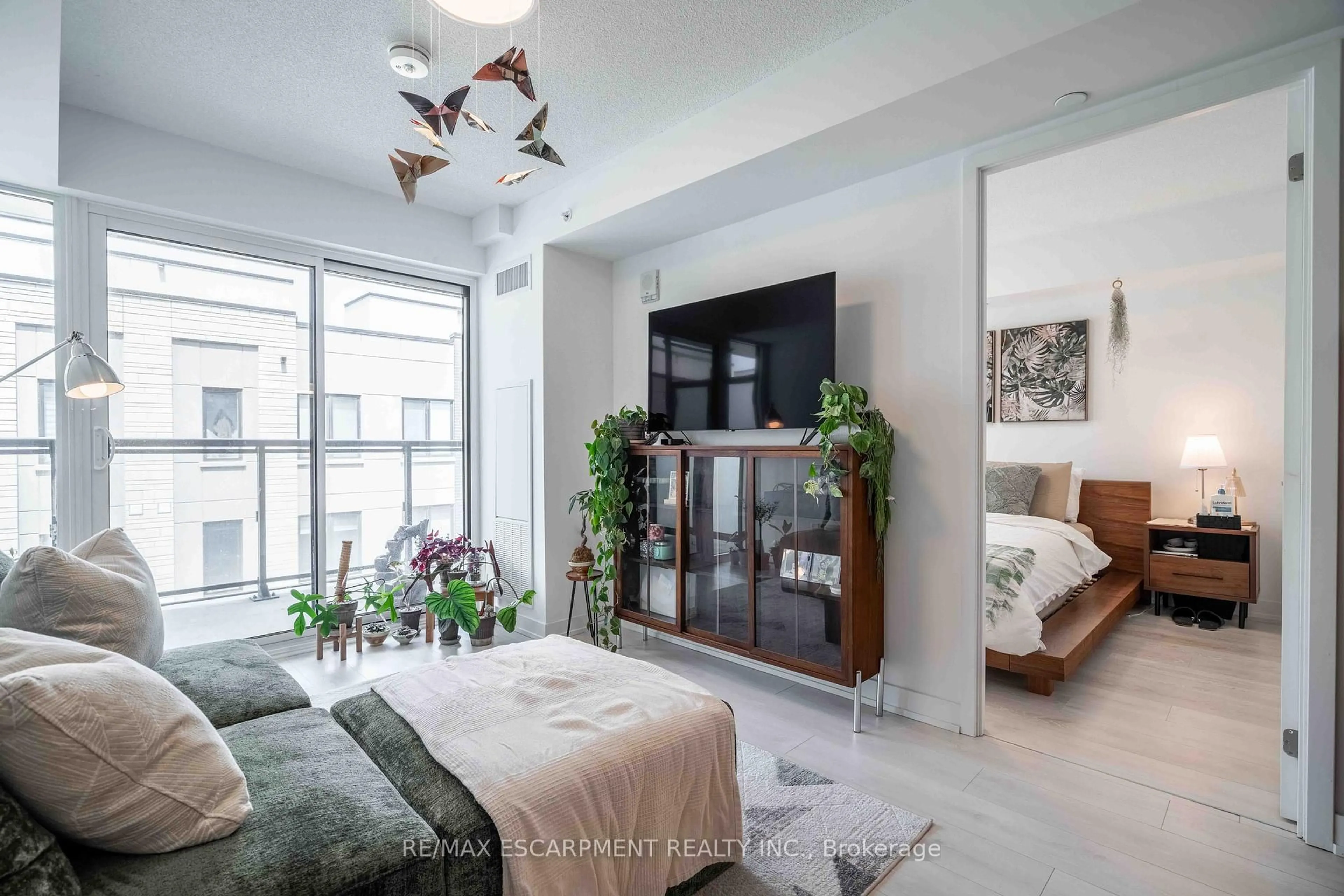 Living room with furniture, unknown for 1117 Cooke Blvd #A310, Burlington Ontario L7T 0C6