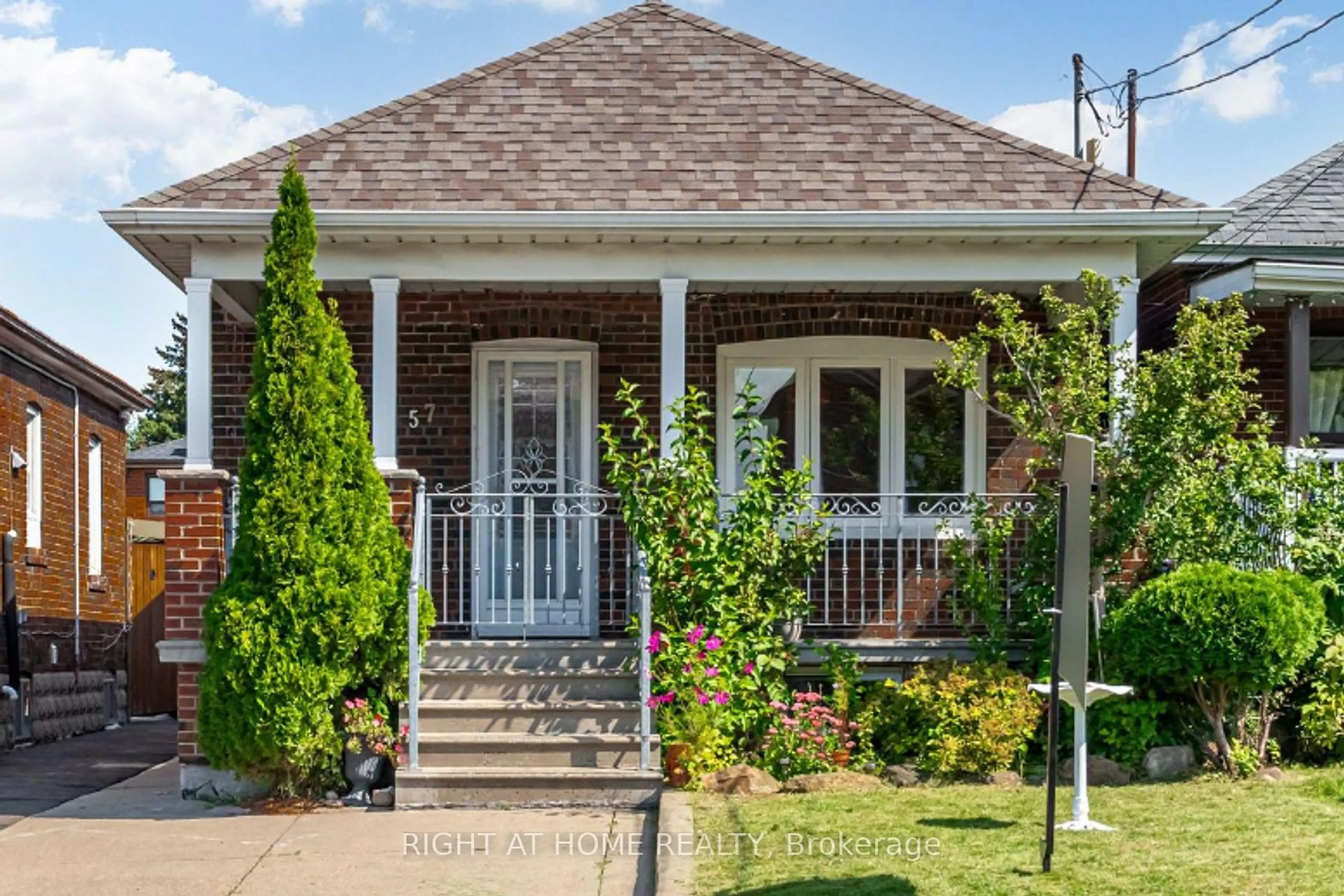 Home with brick exterior material, street for 57 Chamberlain Ave, Toronto Ontario M6E 4J9