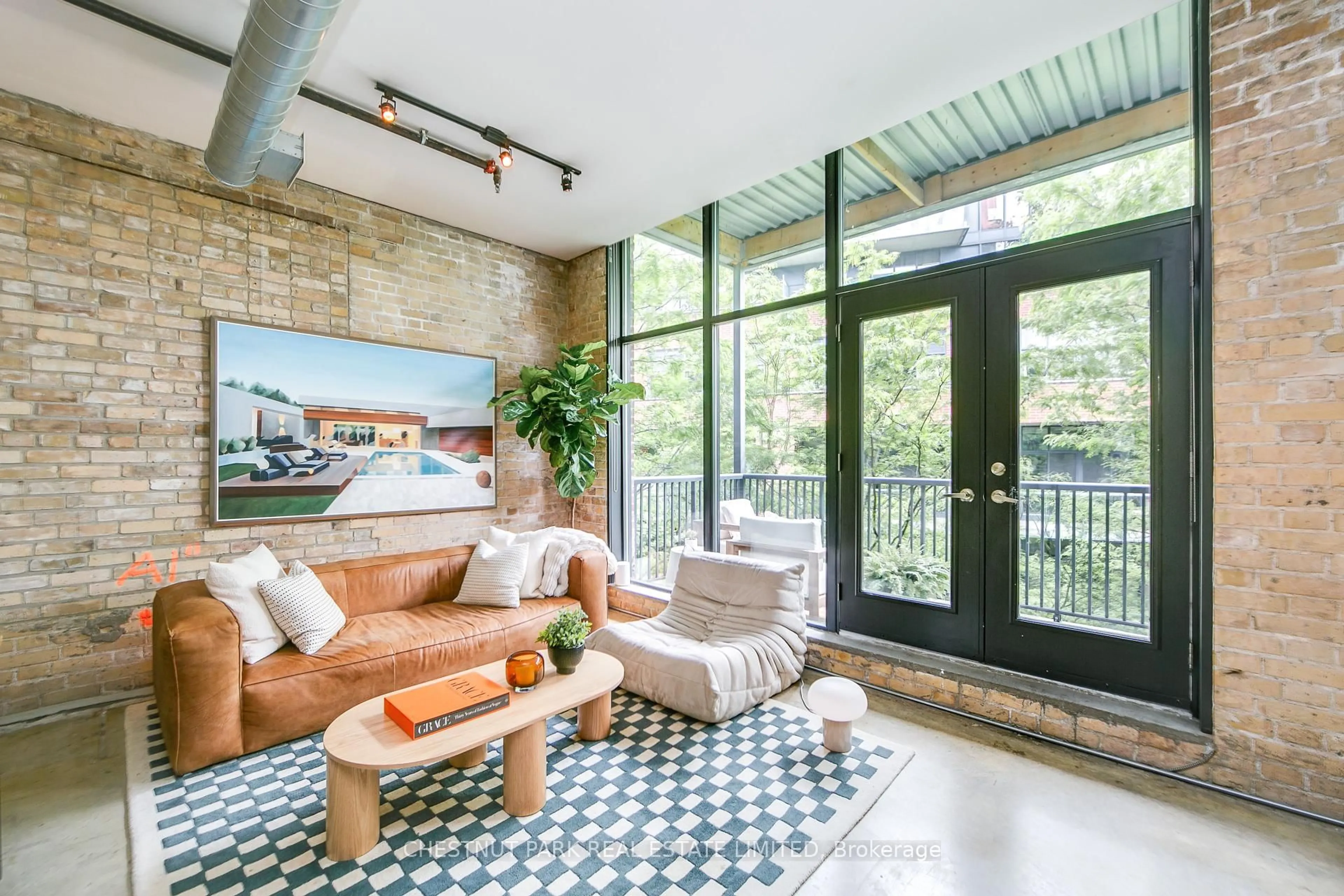 Living room with furniture, cement floor for 363 Sorauren Ave #303, Toronto Ontario M6R 3C1