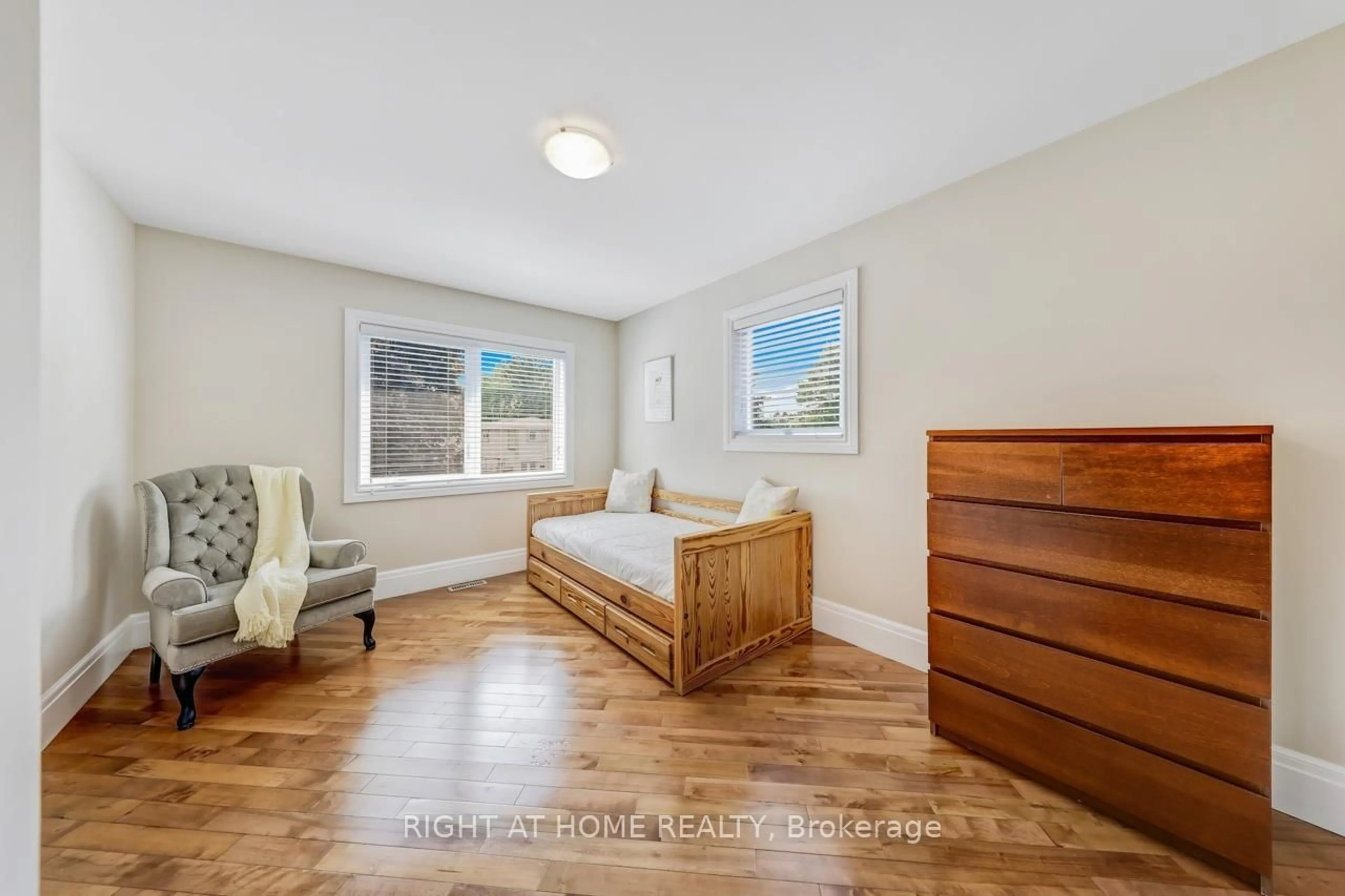 Bedroom with bed, wood/laminate floor for 921 Aviation Rd, Mississauga Ontario L5G 4H8