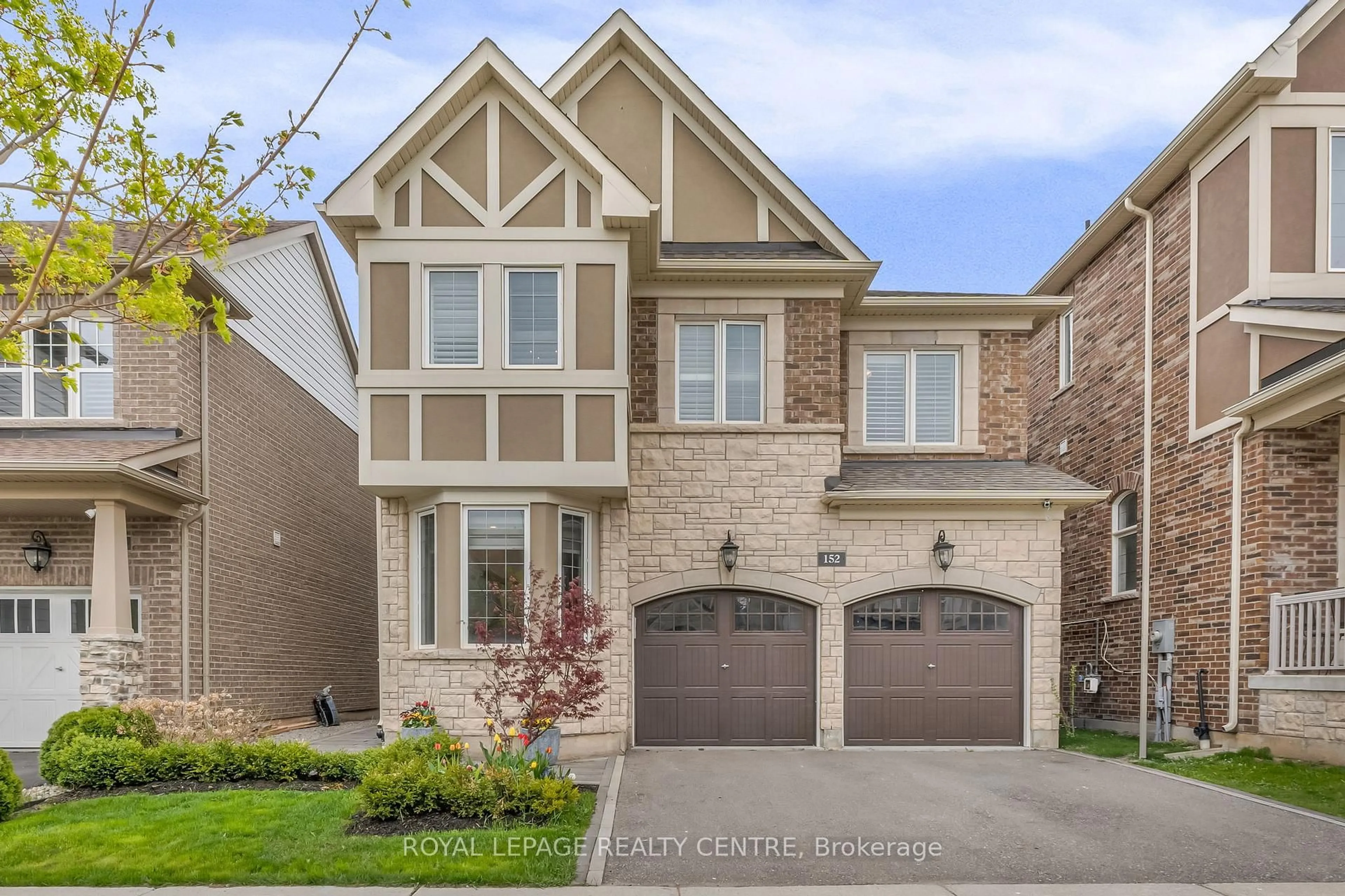 Home with brick exterior material, street for 152 Wheat Boom Dr, Oakville Ontario L6H 0M8