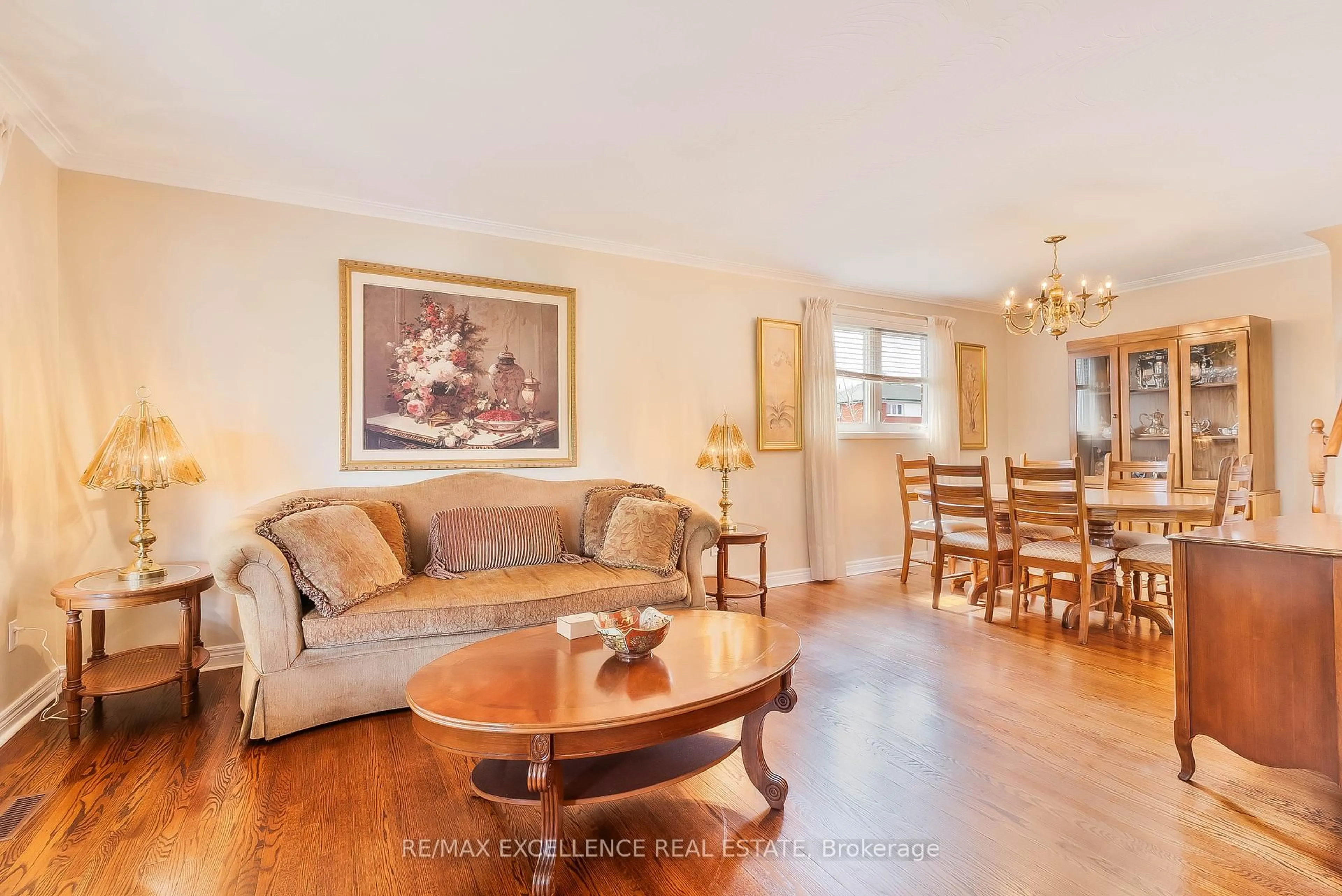 Living room with furniture, wood/laminate floor for 90 Goldsboro Rd, Toronto Ontario N9L 1A8