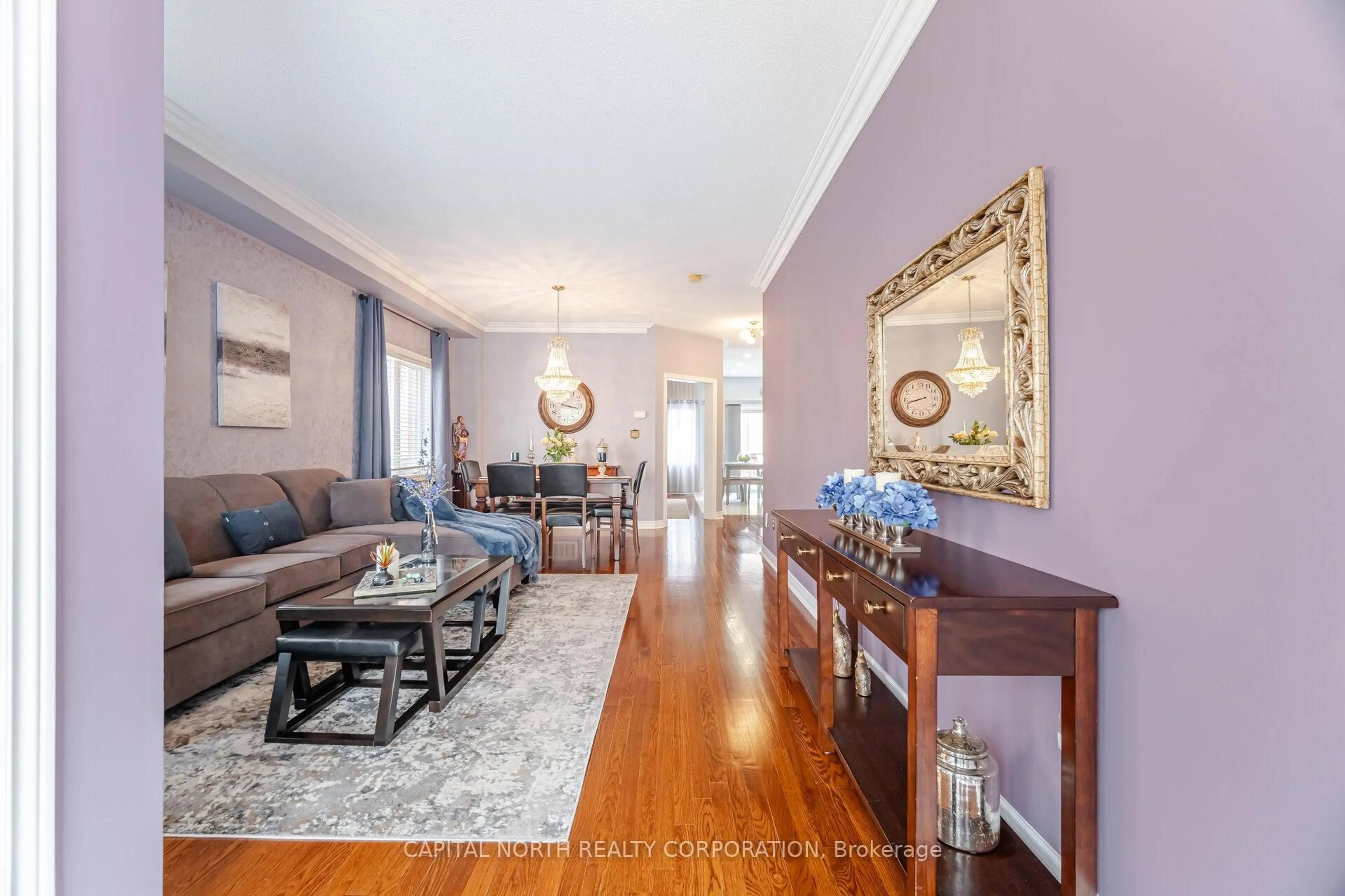 Living room with furniture, wood/laminate floor for 7 Klondike Tr, Brampton Ontario L6R 3K6