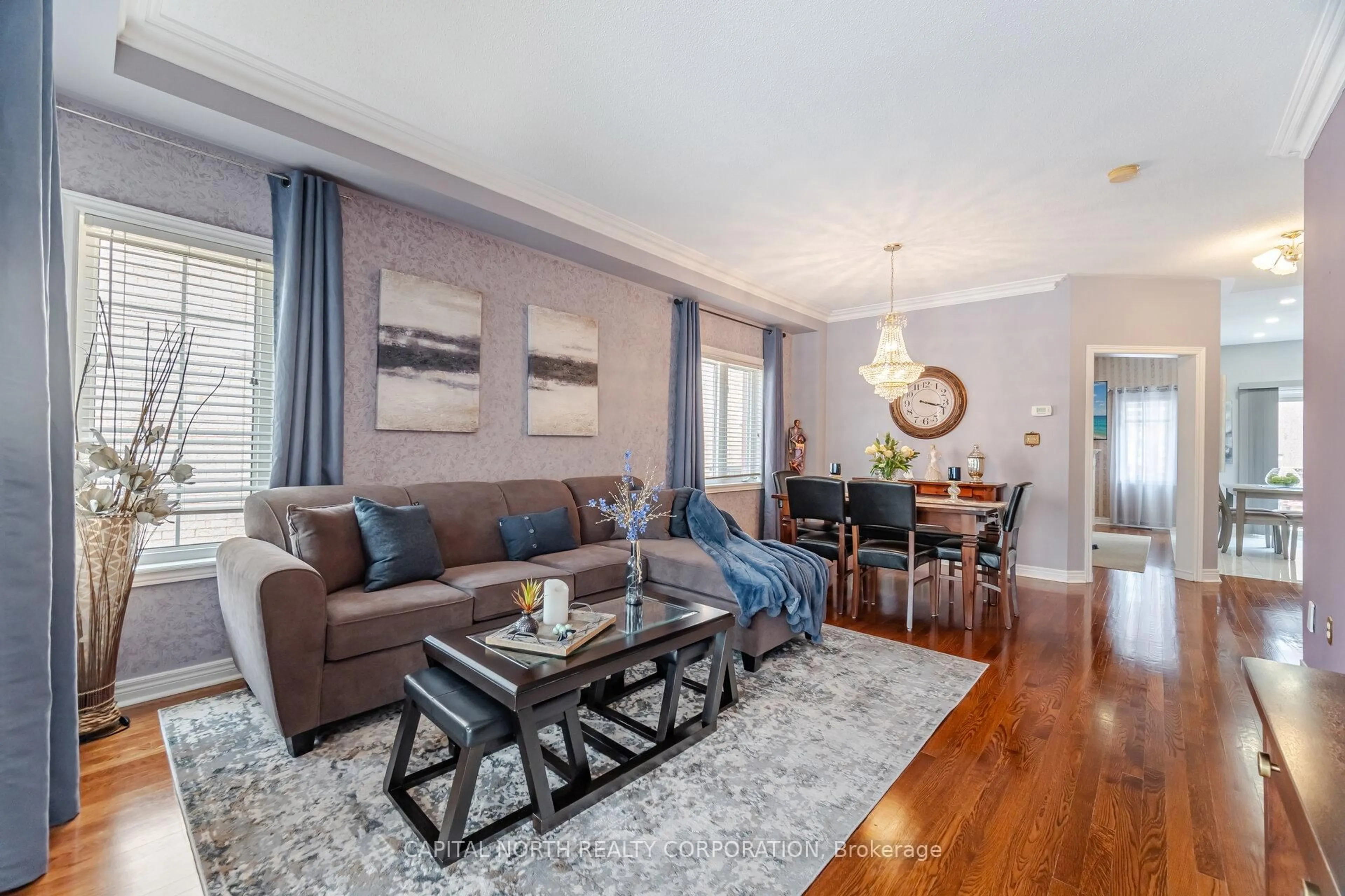 Living room with furniture, wood/laminate floor for 7 Klondike Tr, Brampton Ontario L6R 3K6