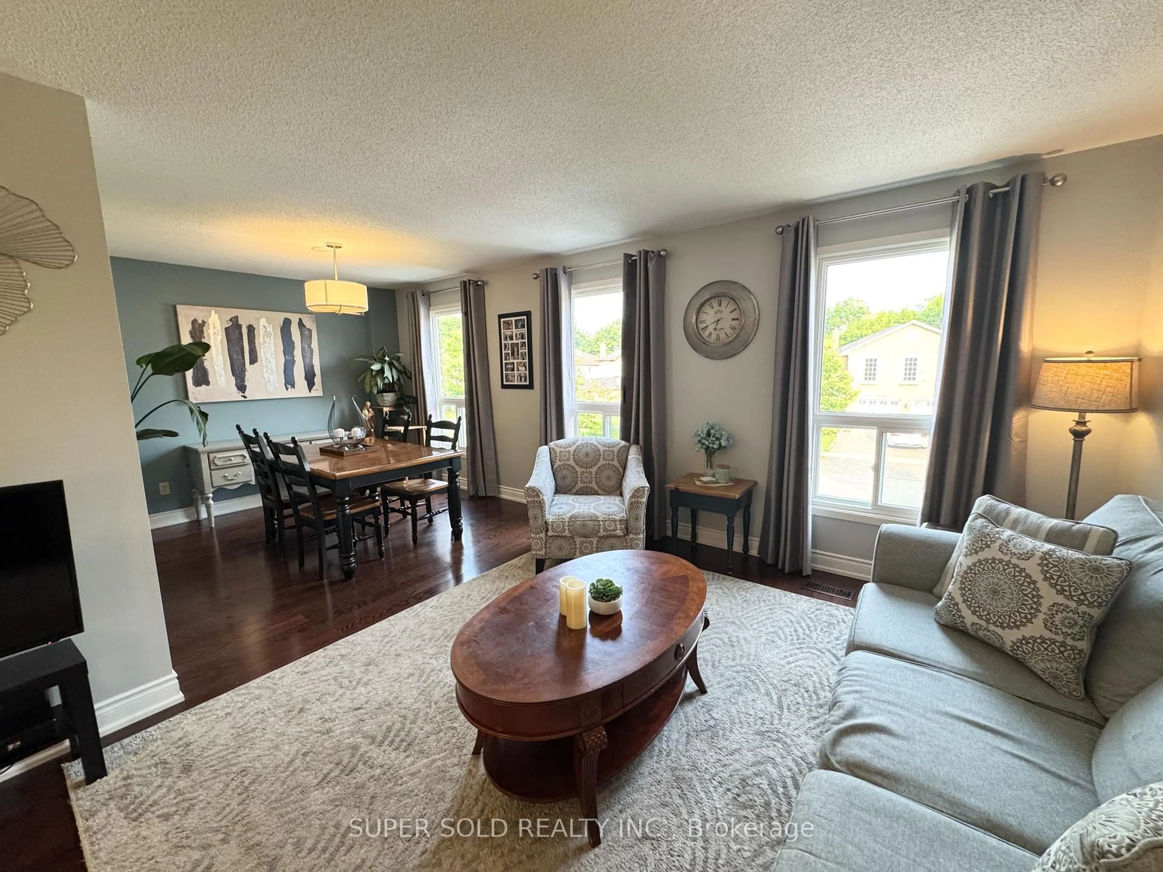 Living room with furniture, wood/laminate floor for 25 Floribunda Cres, Brampton Ontario L6T 4R8