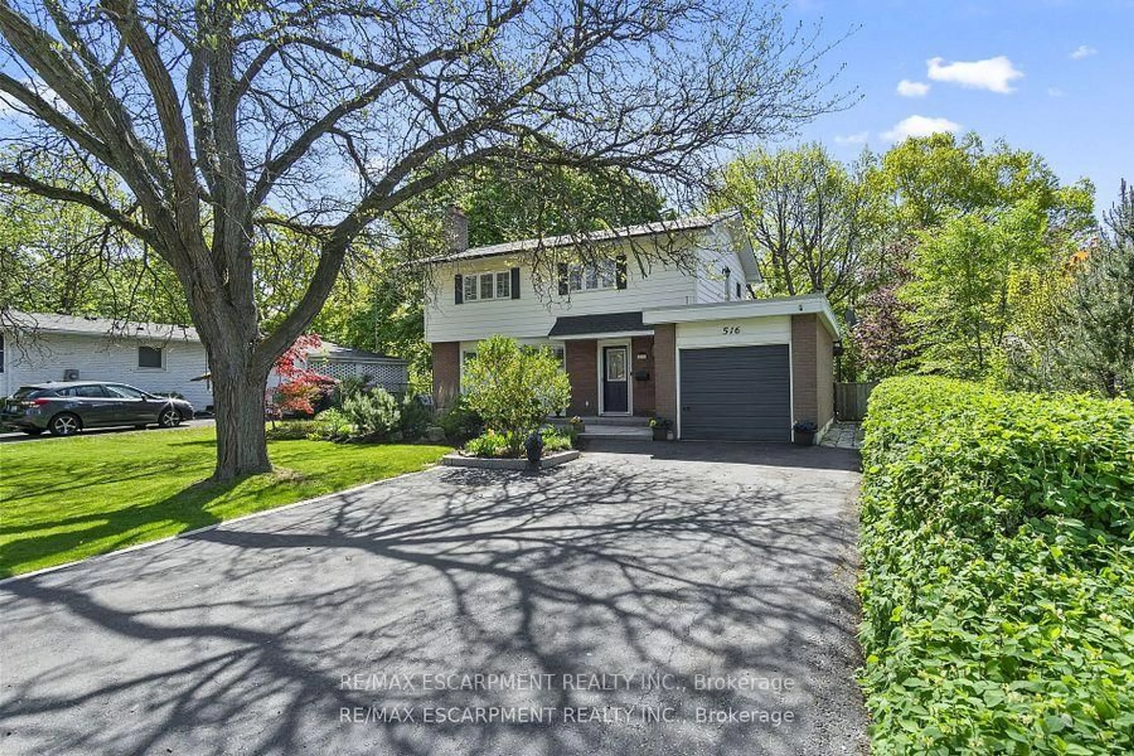 Home with brick exterior material, street for 516 Falgarwood Dr, Oakville Ontario L6H 1N3