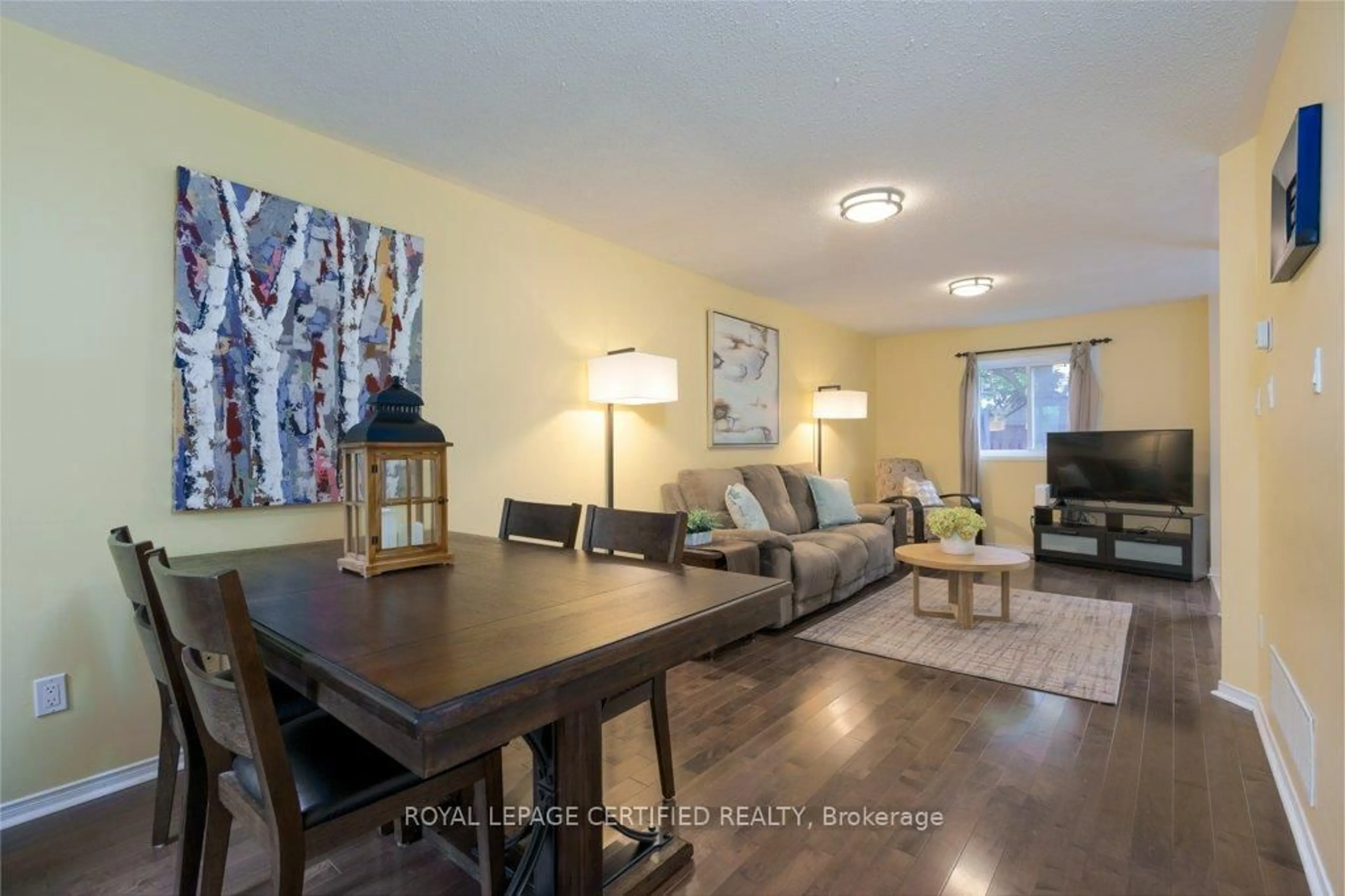 Living room with furniture, wood/laminate floor for 38 Banner Rd, Brampton Ontario L6X 4K8