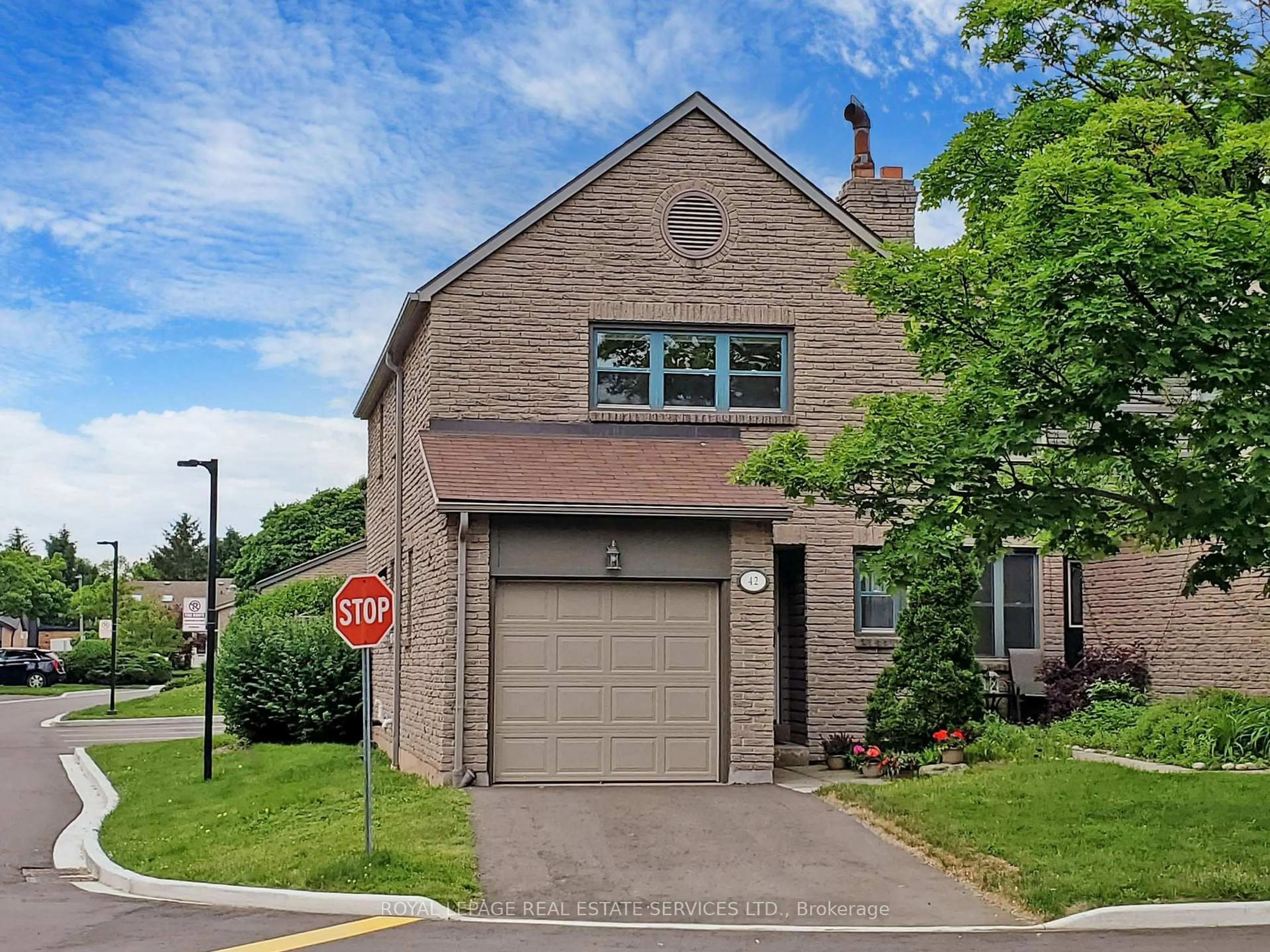 Home with brick exterior material, street for 4111 Arbour Green Dr #42, Mississauga Ontario L5L 2Z2