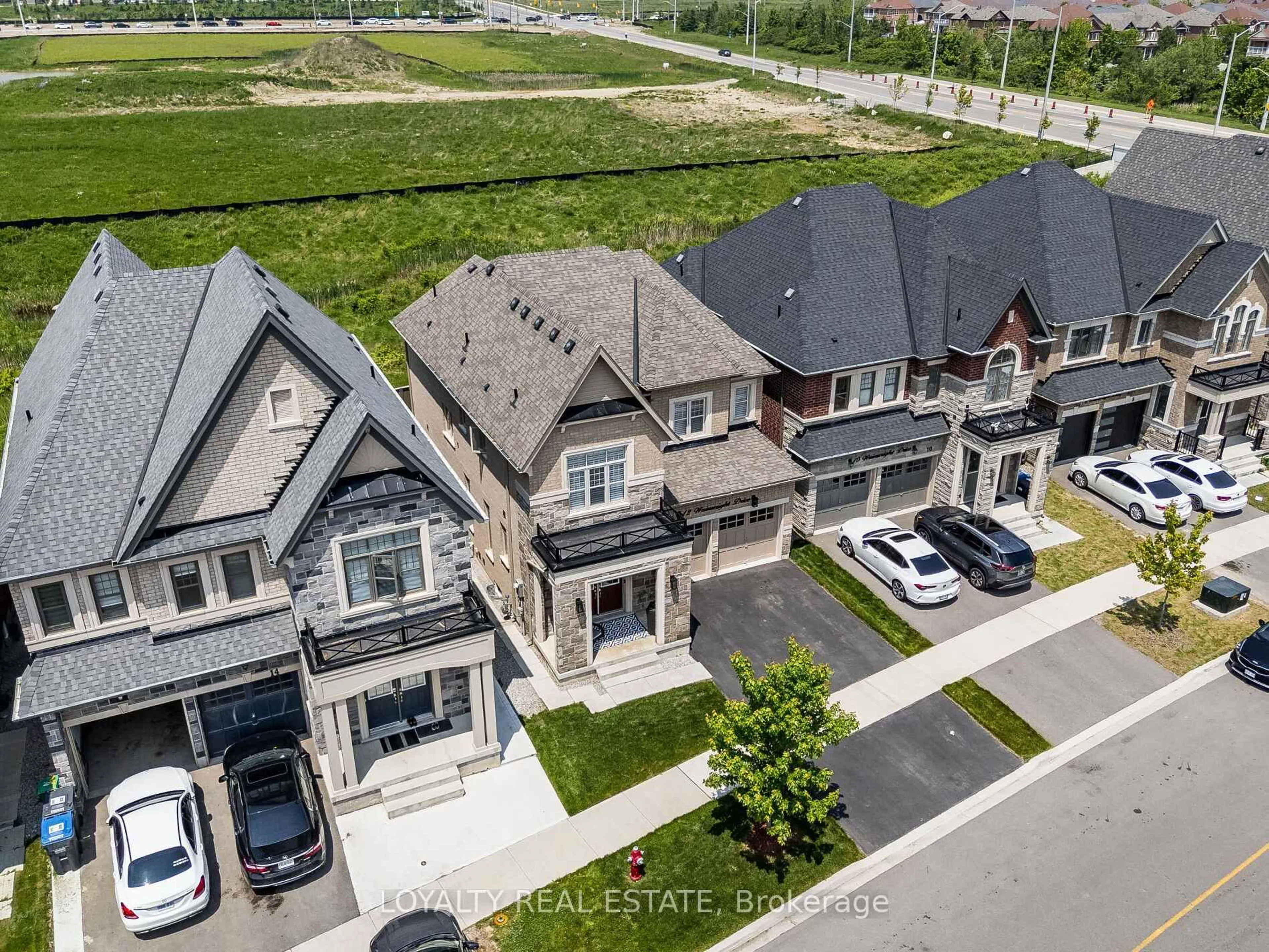 A pic from outside/outdoor area/front of a property/back of a property/a pic from drone, street for 12 Wainwright Dr, Brampton Ontario L7A 4Y6