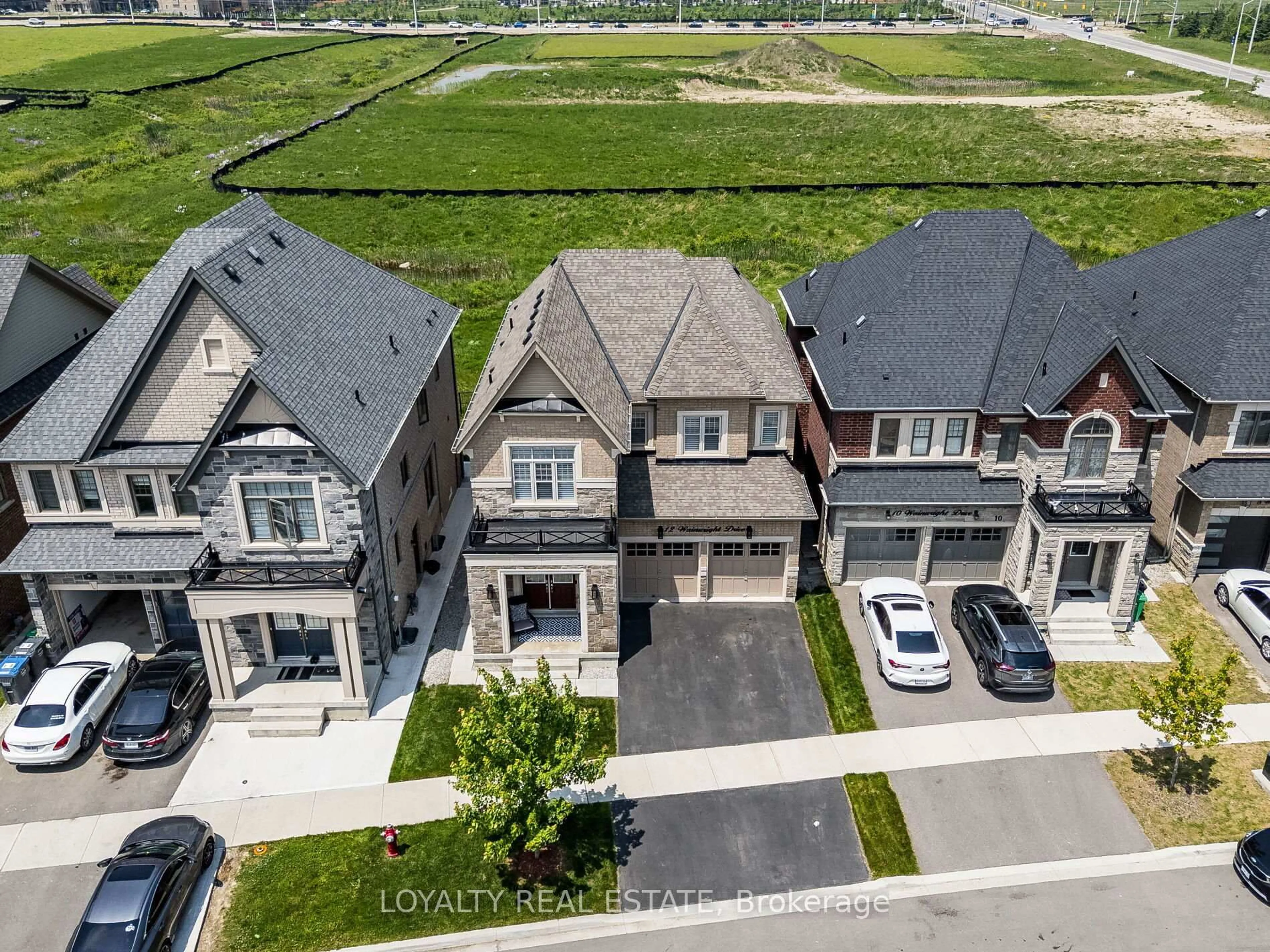 A pic from outside/outdoor area/front of a property/back of a property/a pic from drone, street for 12 Wainwright Dr, Brampton Ontario L7A 4Y6