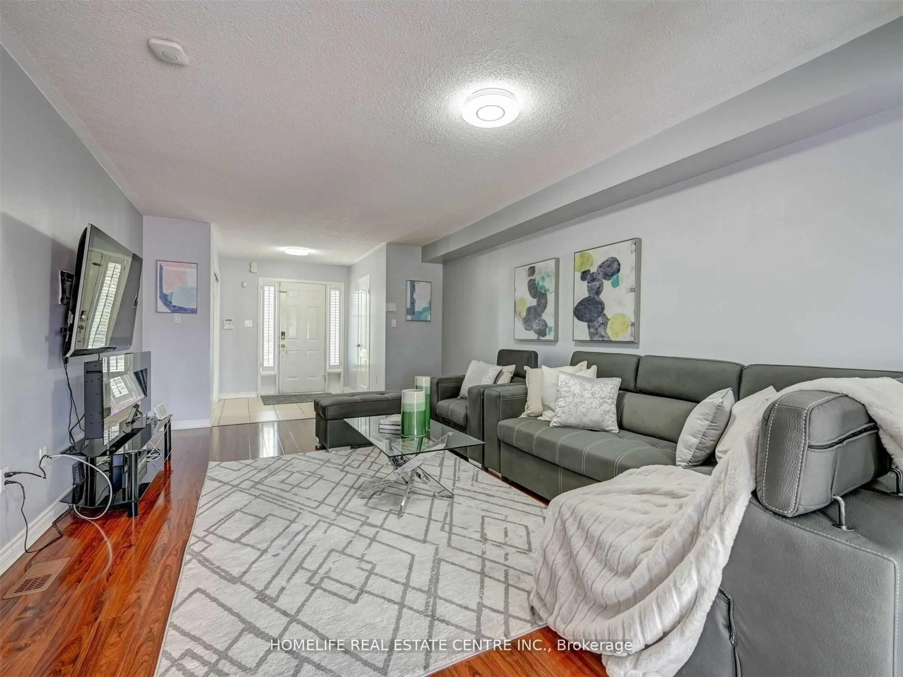 Living room with furniture, unknown for 77 Beavervalley Dr, Brampton Ontario L7A 3R3