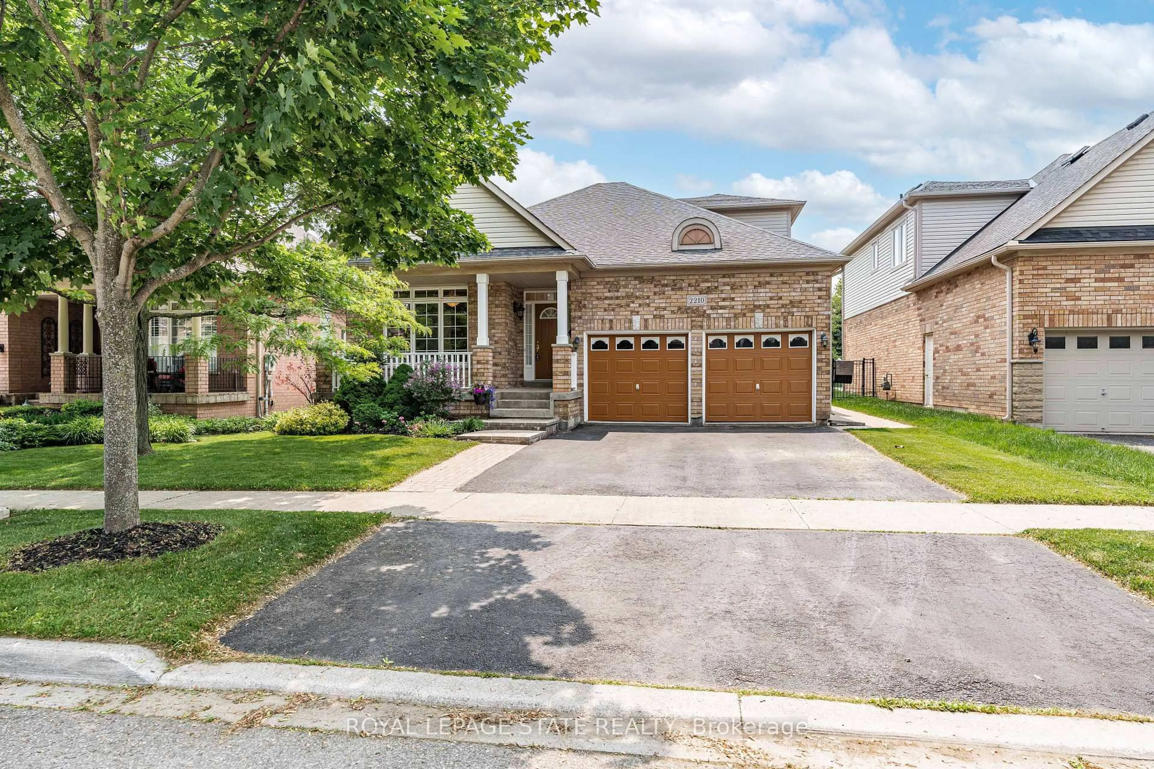 Home with brick exterior material, street for 2210 Tiger Rd, Burlington Ontario L7M 4W9