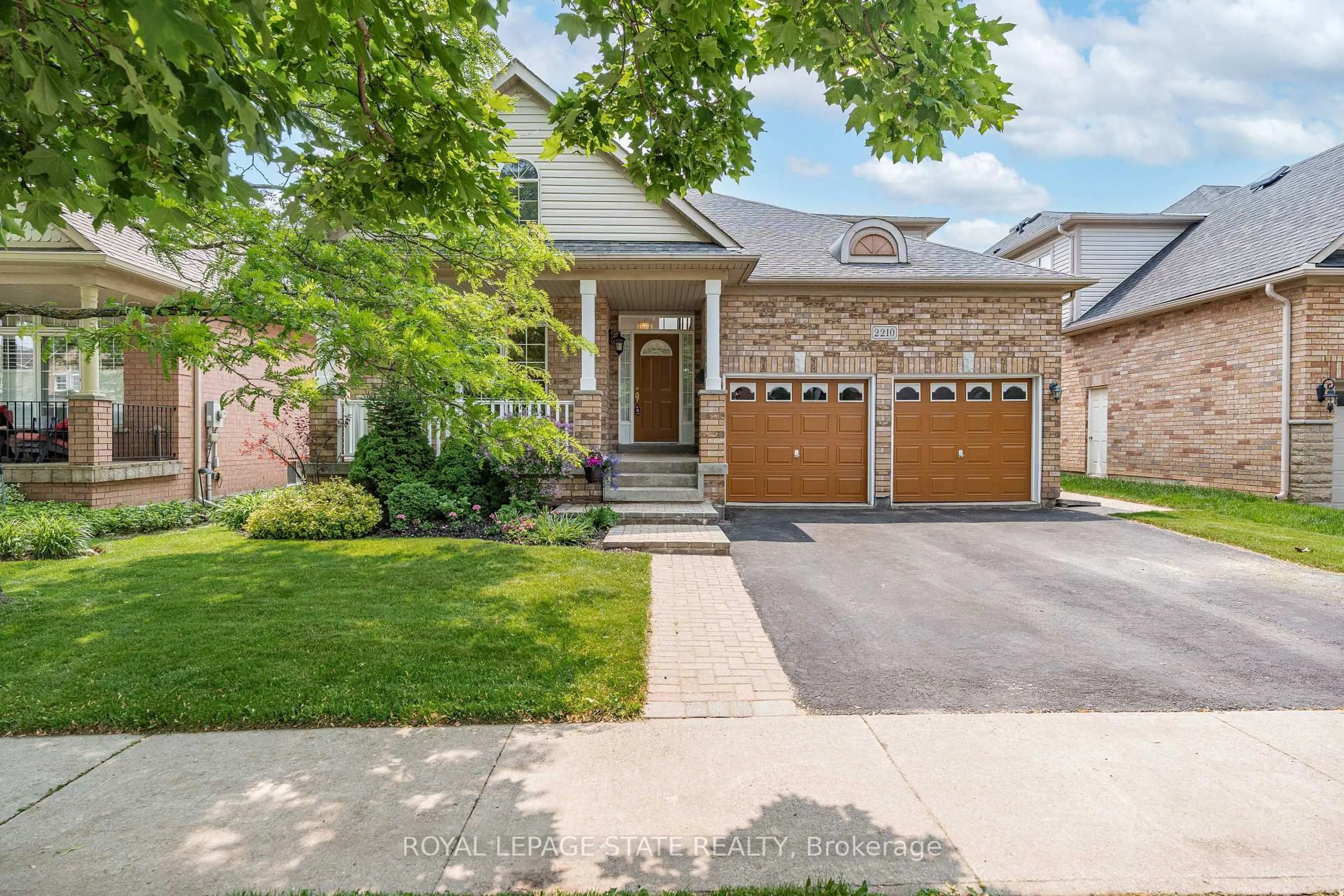 Home with brick exterior material, street for 2210 Tiger Rd, Burlington Ontario L7M 4W9