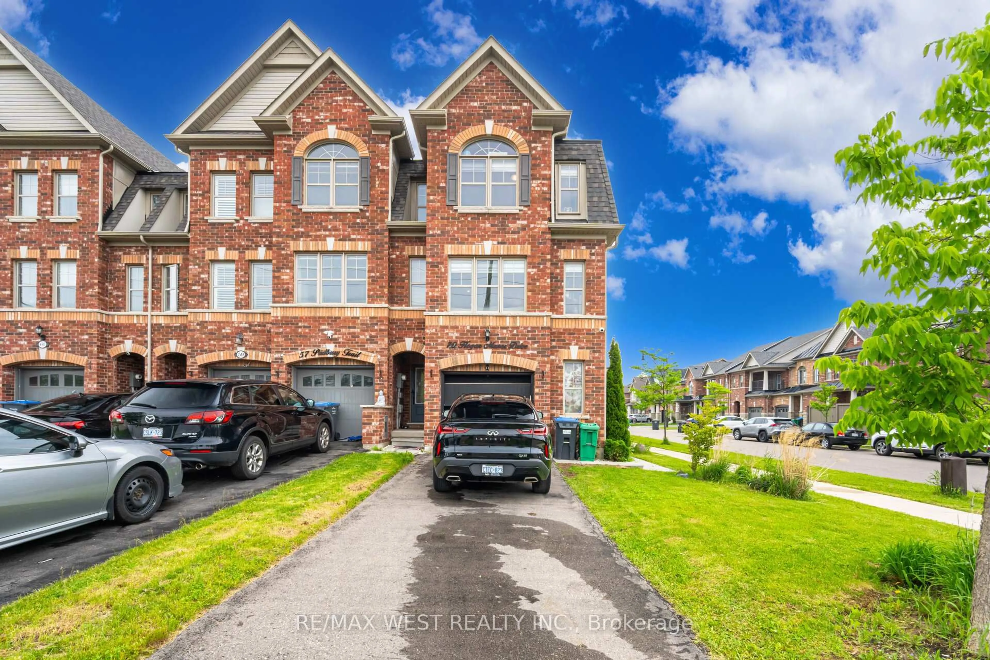 Home with brick exterior material, street for 70 Hogan Manor Dr, Brampton Ontario L7A 4V3