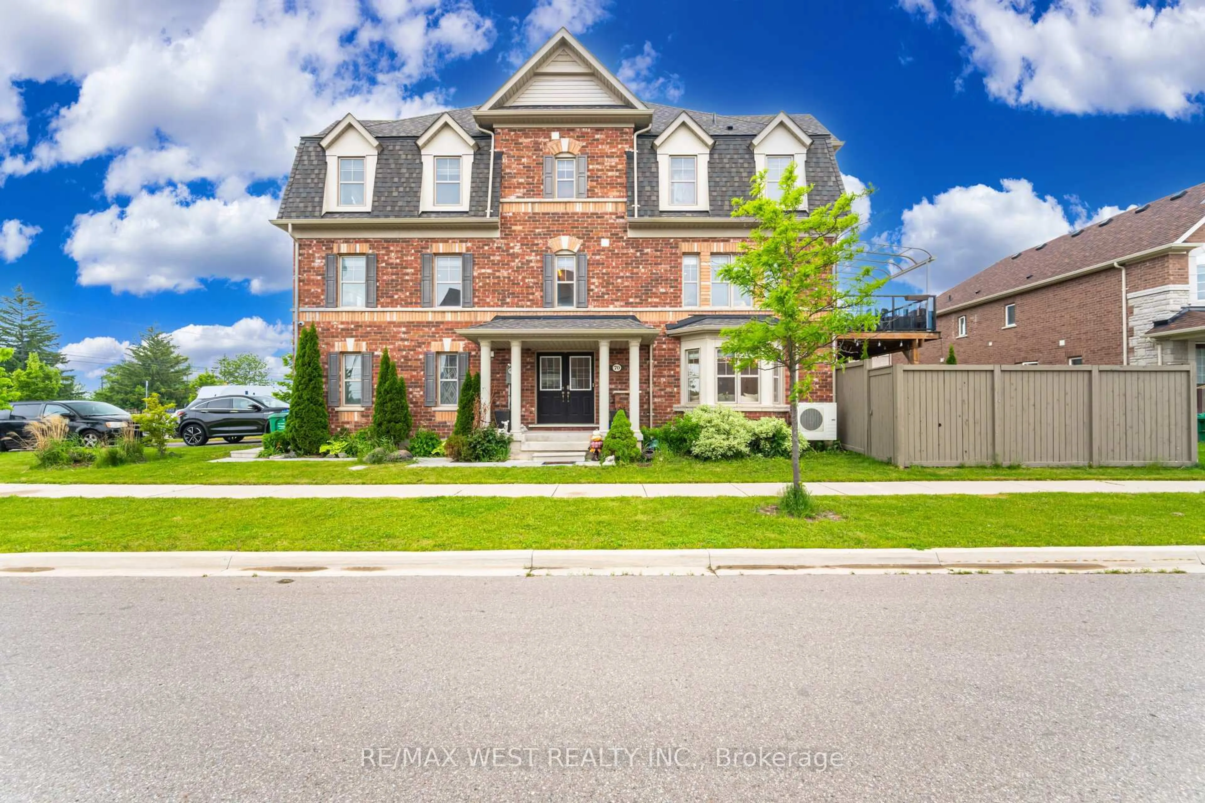 Home with brick exterior material, street for 70 Hogan Manor Dr, Brampton Ontario L7A 4V3