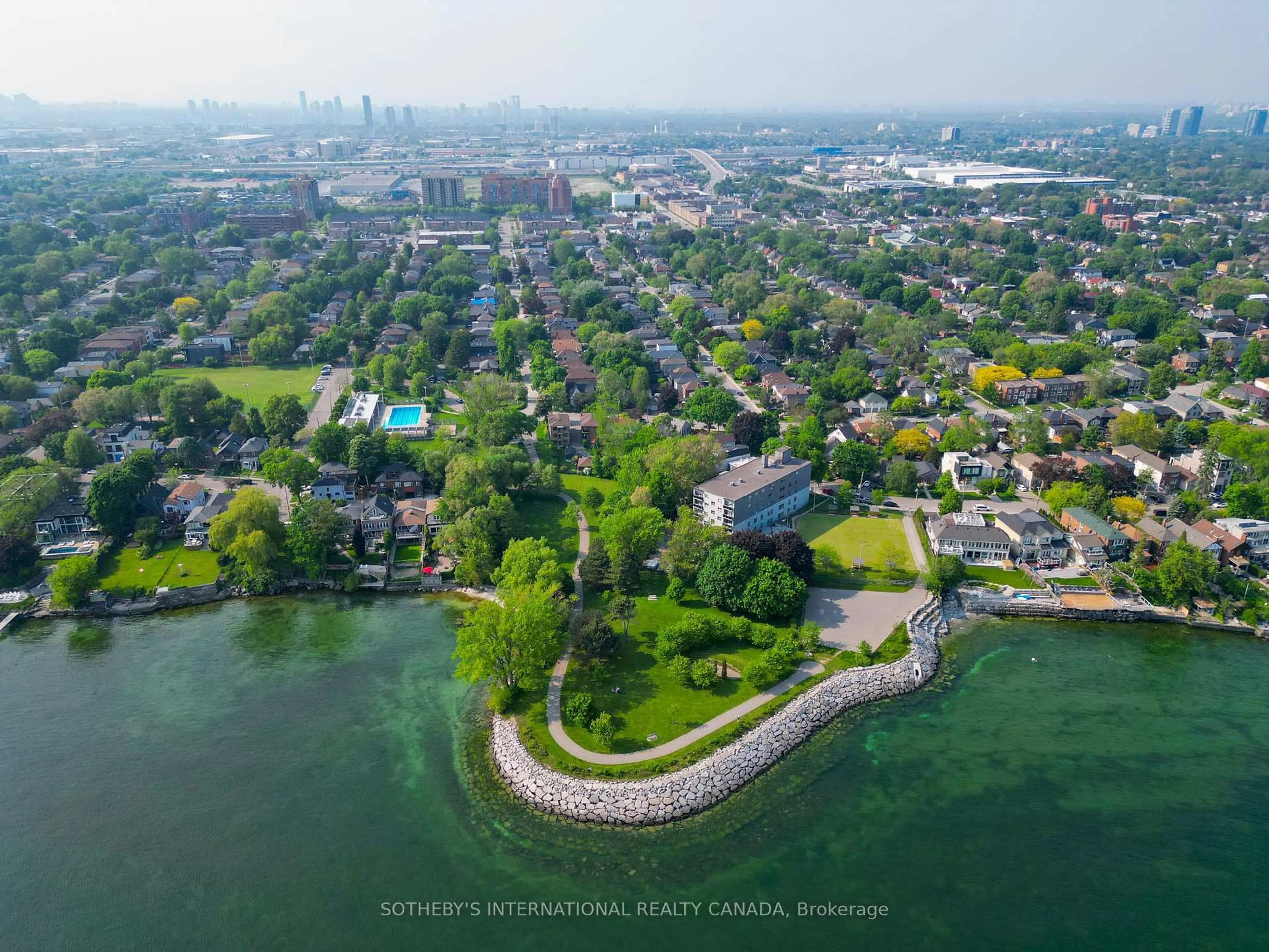 A pic from outside/outdoor area/front of a property/back of a property/a pic from drone, water/lake/river/ocean view for 165 Lake Shore Dr, Toronto Ontario M8V 2A1
