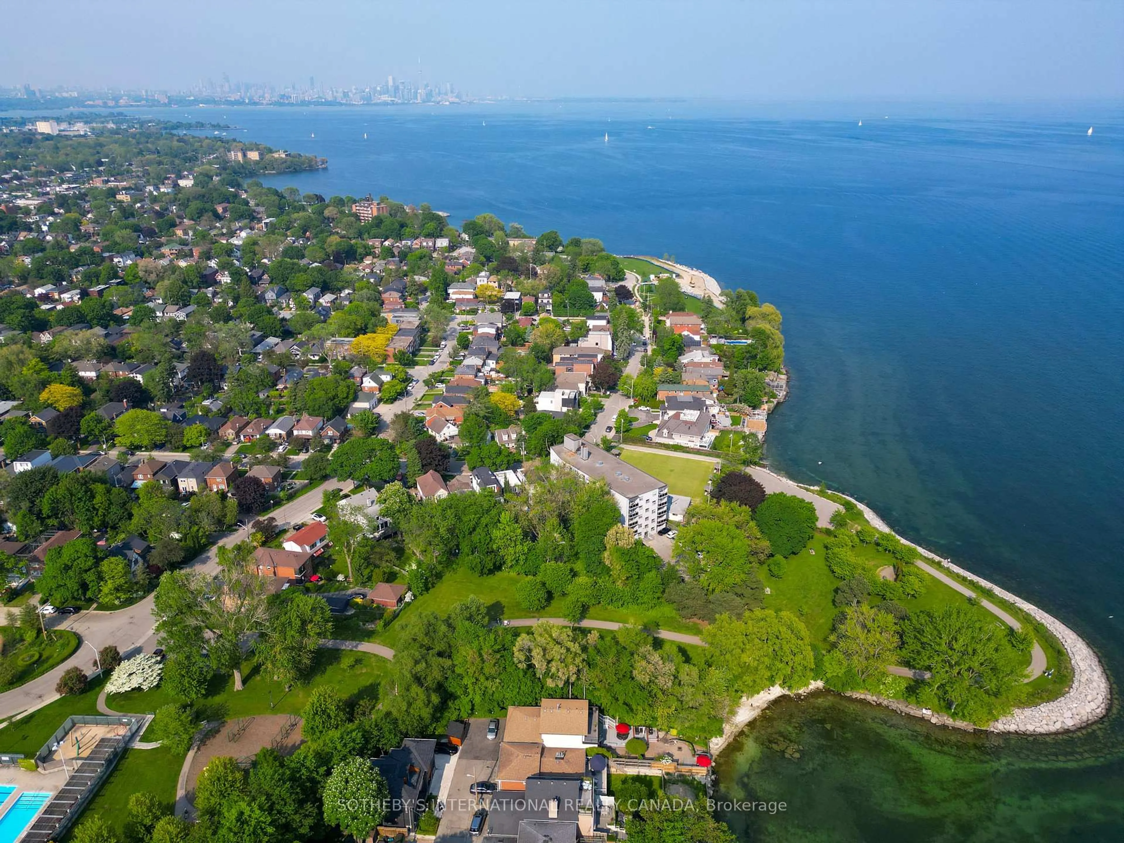 A pic from outside/outdoor area/front of a property/back of a property/a pic from drone, water/lake/river/ocean view for 165 Lake Shore Dr, Toronto Ontario M8V 2A1