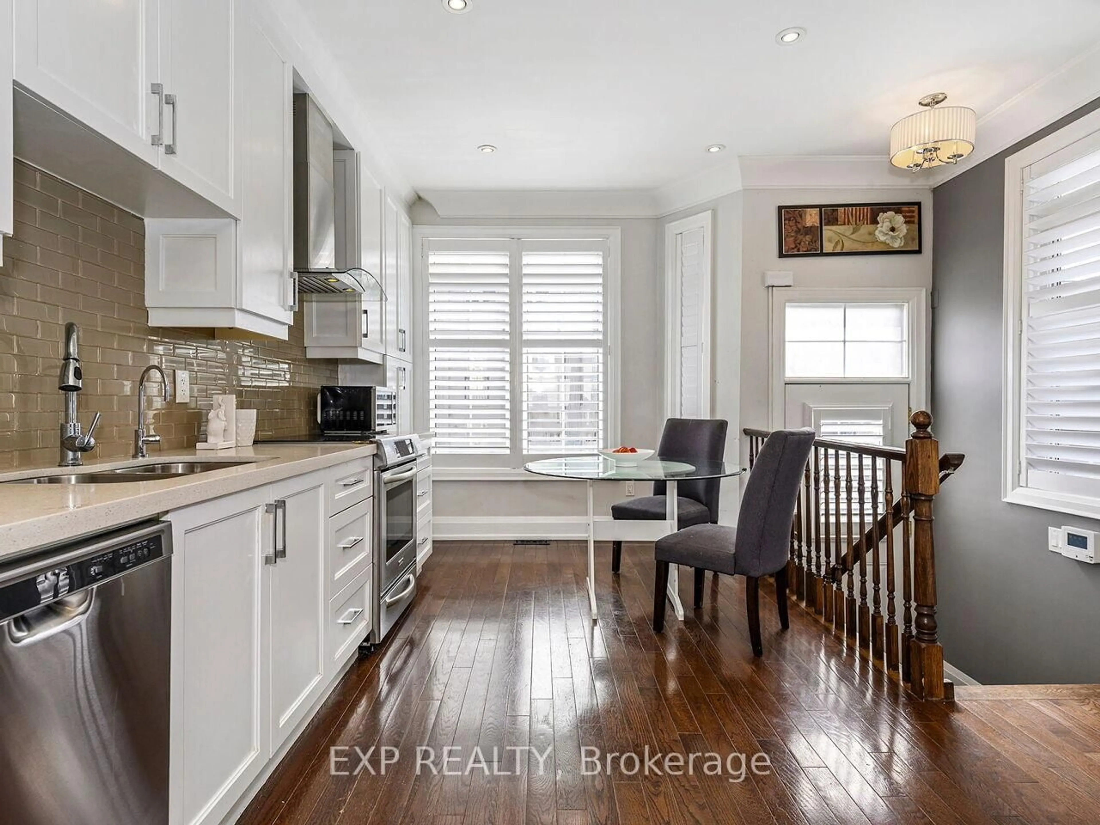 Open concept kitchen, wood/laminate floor for 2351 Lakeshore Rd #4, Oakville Ontario L6L 1H4