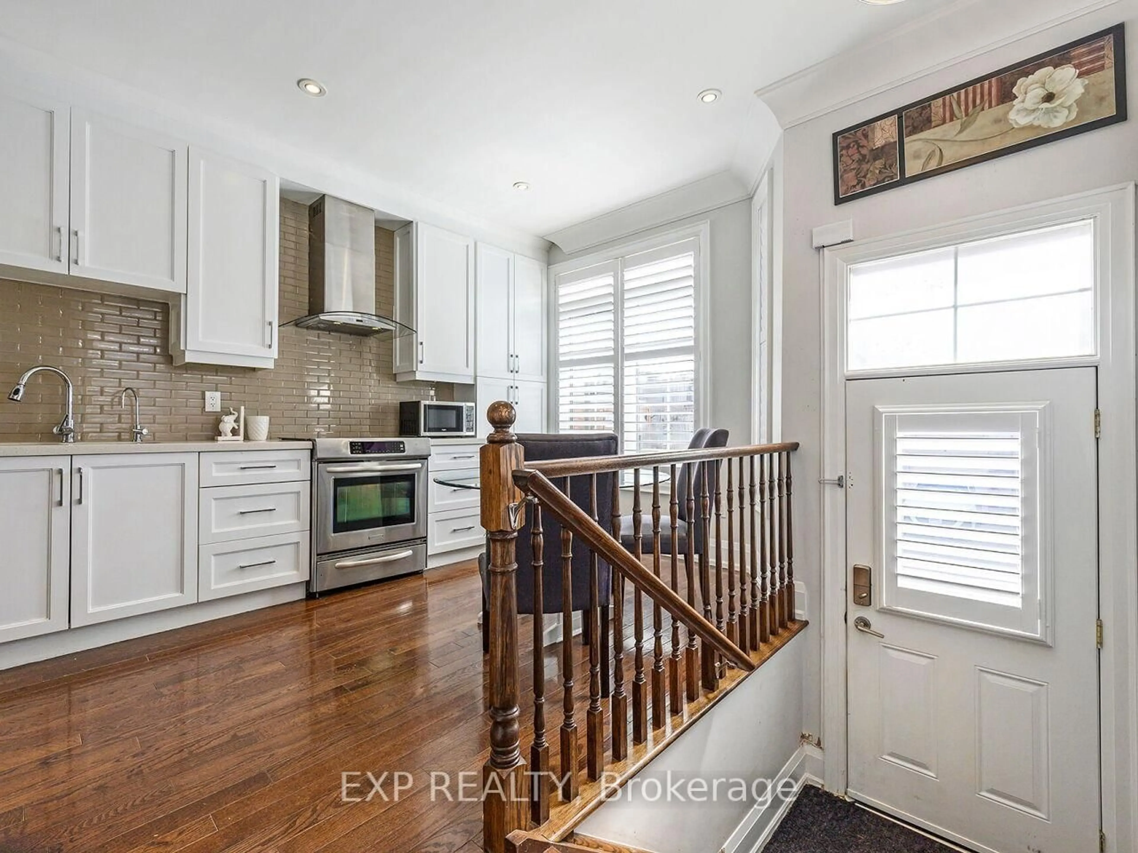 Open concept kitchen, wood/laminate floor for 2351 Lakeshore Rd #4, Oakville Ontario L6L 1H4