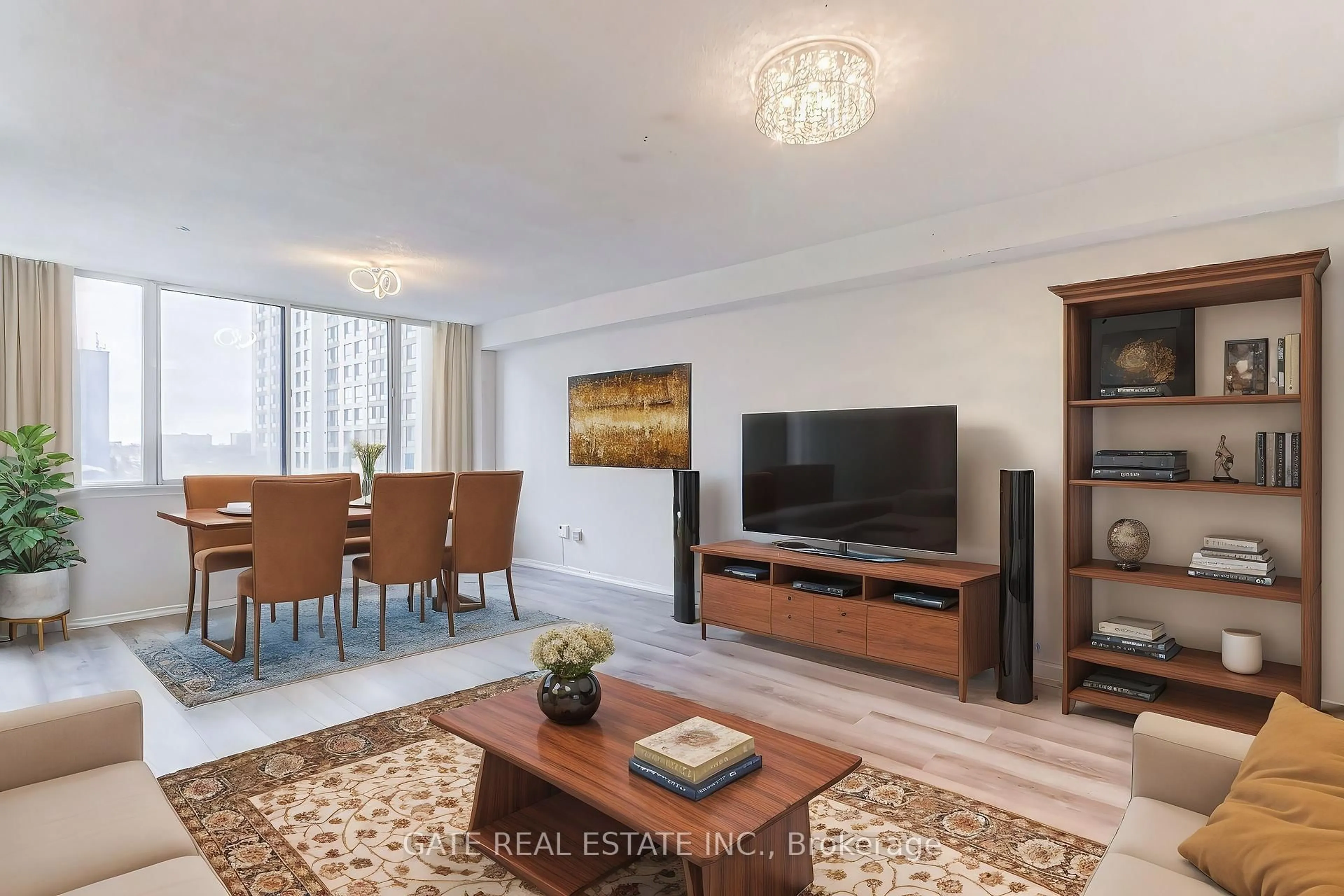 Living room with furniture, wood/laminate floor for 10 Markbrook Lane #604, Toronto Ontario M9V 5E3