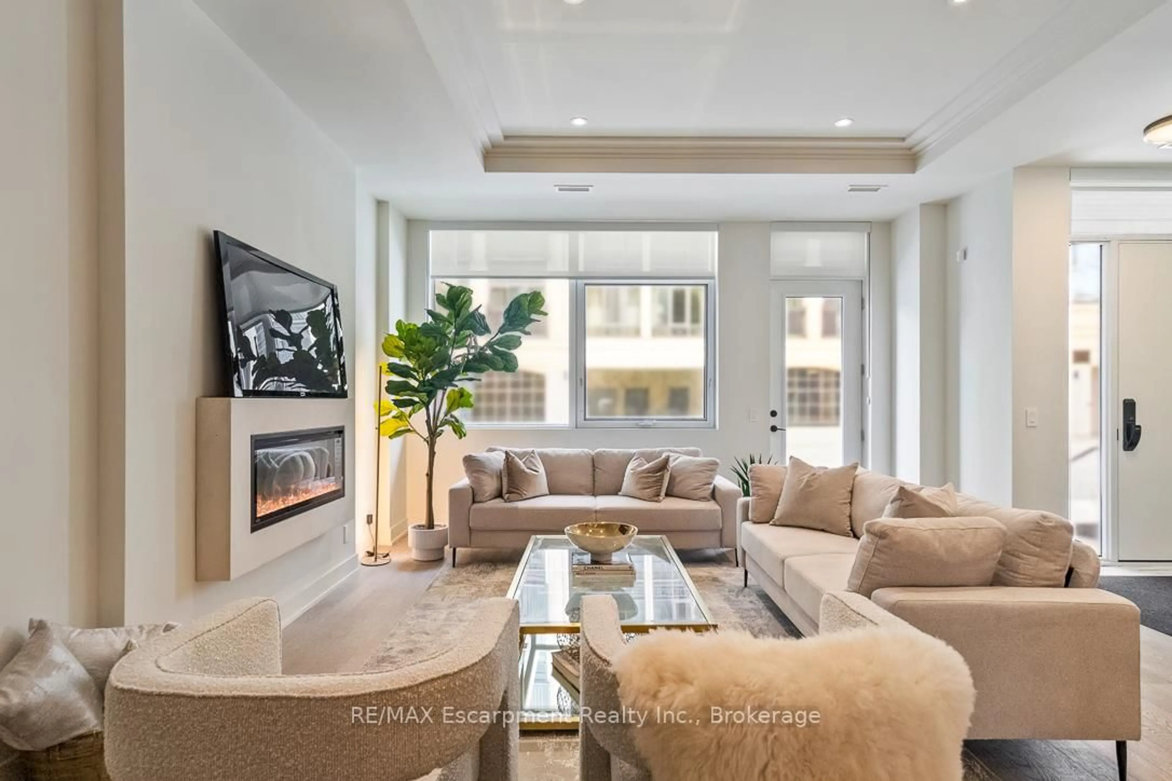 Living room with furniture, unknown for 123 Maurice Dr #105, Oakville Ontario L6K 2W6