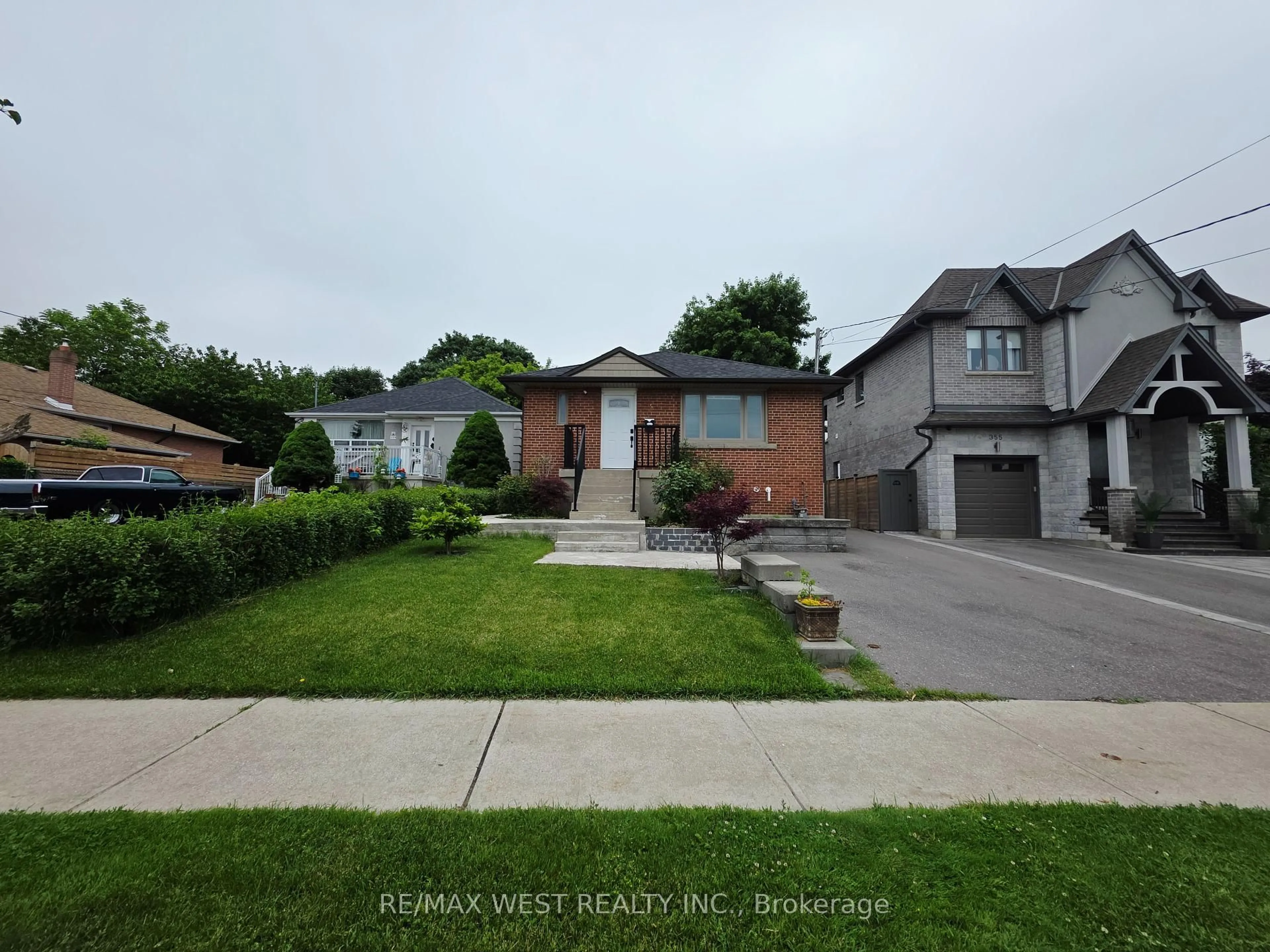 A pic from outside/outdoor area/front of a property/back of a property/a pic from drone, street for 357 Rustic Rd, Toronto Ontario M6L 1W6
