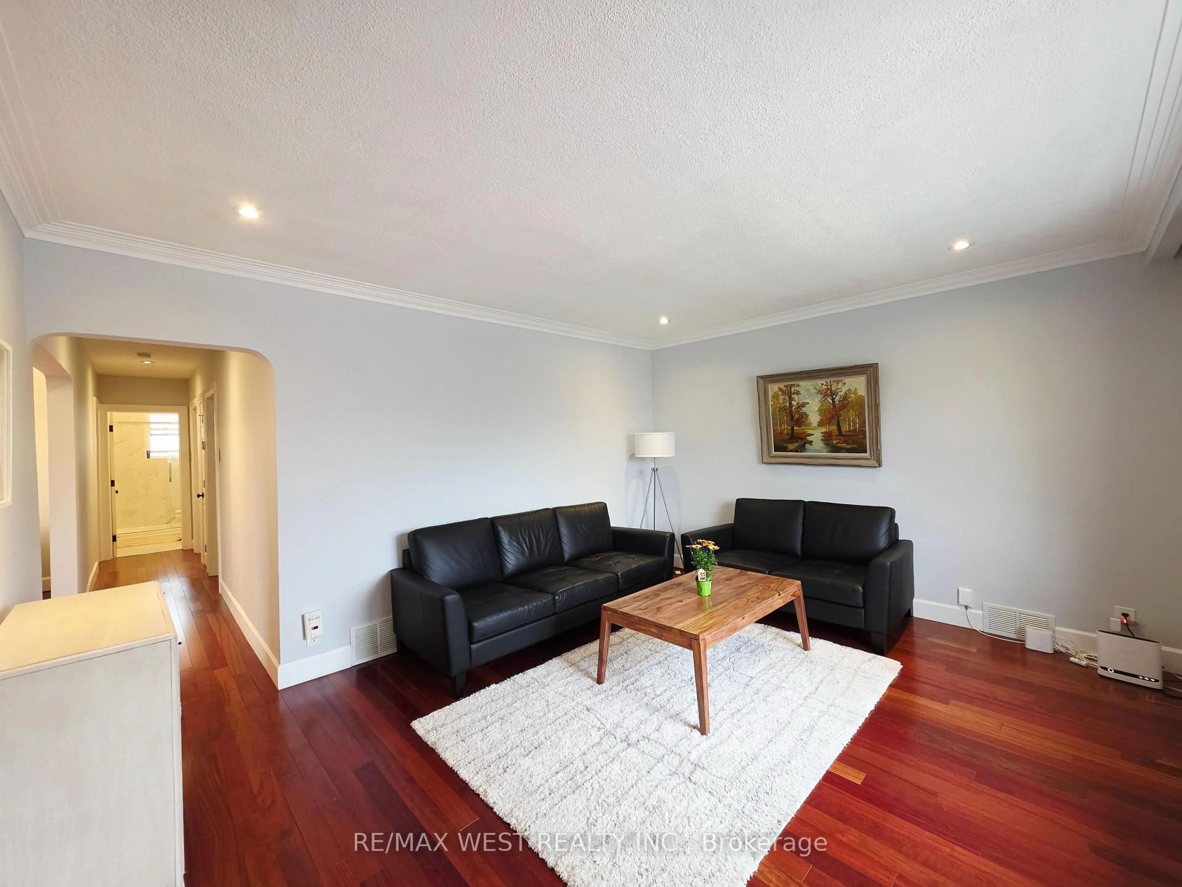 Living room with furniture, wood/laminate floor for 357 Rustic Rd, Toronto Ontario M6L 1W6