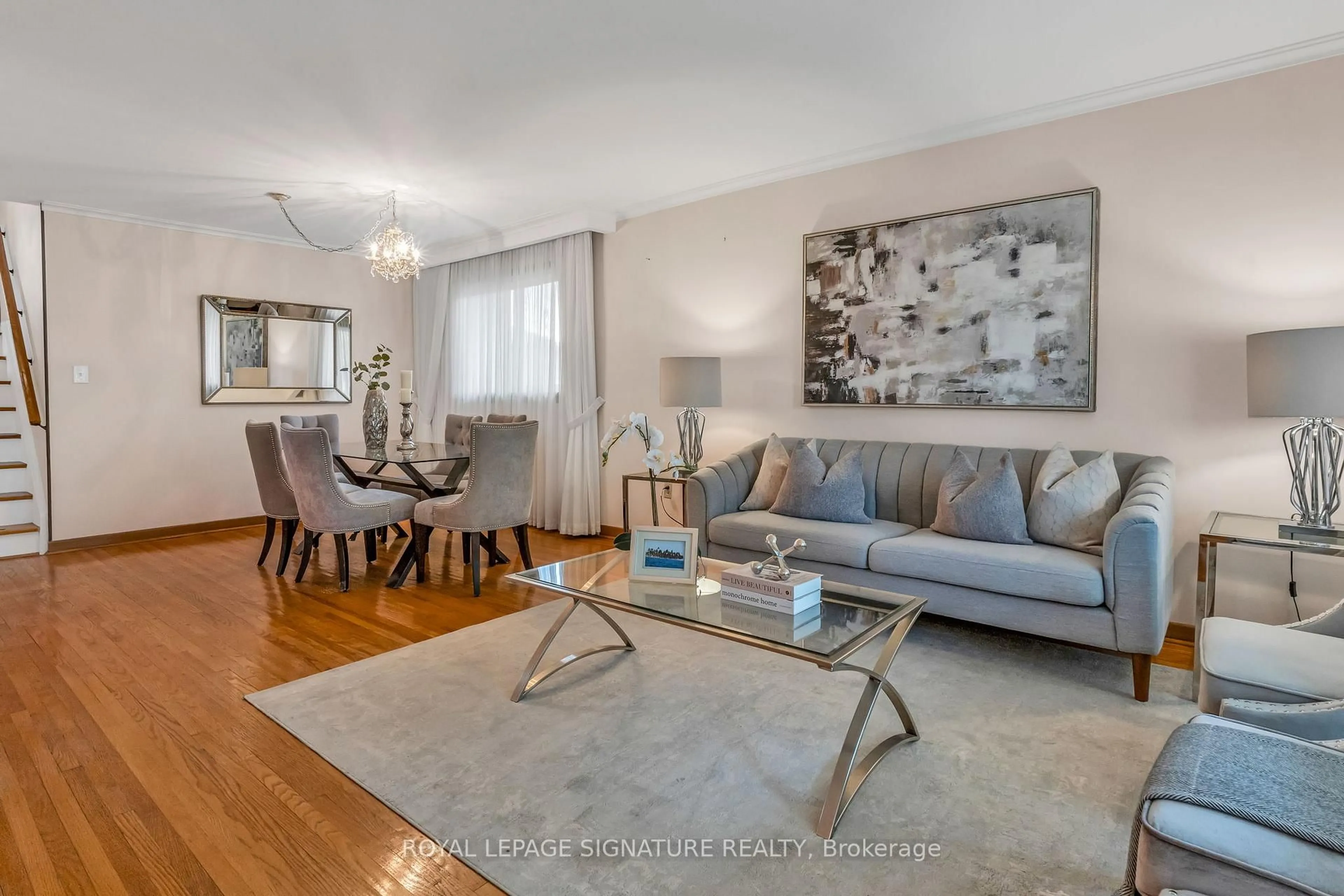 Living room with furniture, wood/laminate floor for 7 West Wareside Rd, Toronto Ontario M9C 3H9