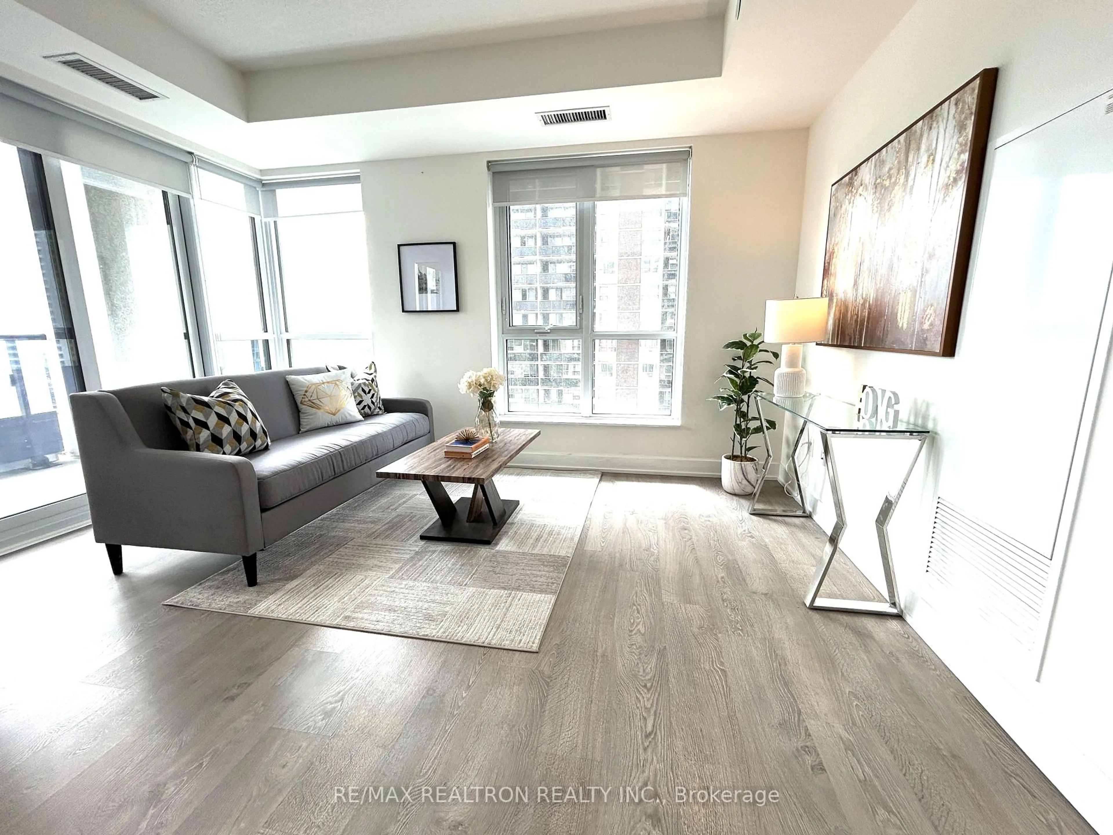 Living room with furniture, wood/laminate floor for 9 Mabelle Ave #924, Toronto Ontario M9A 0E1
