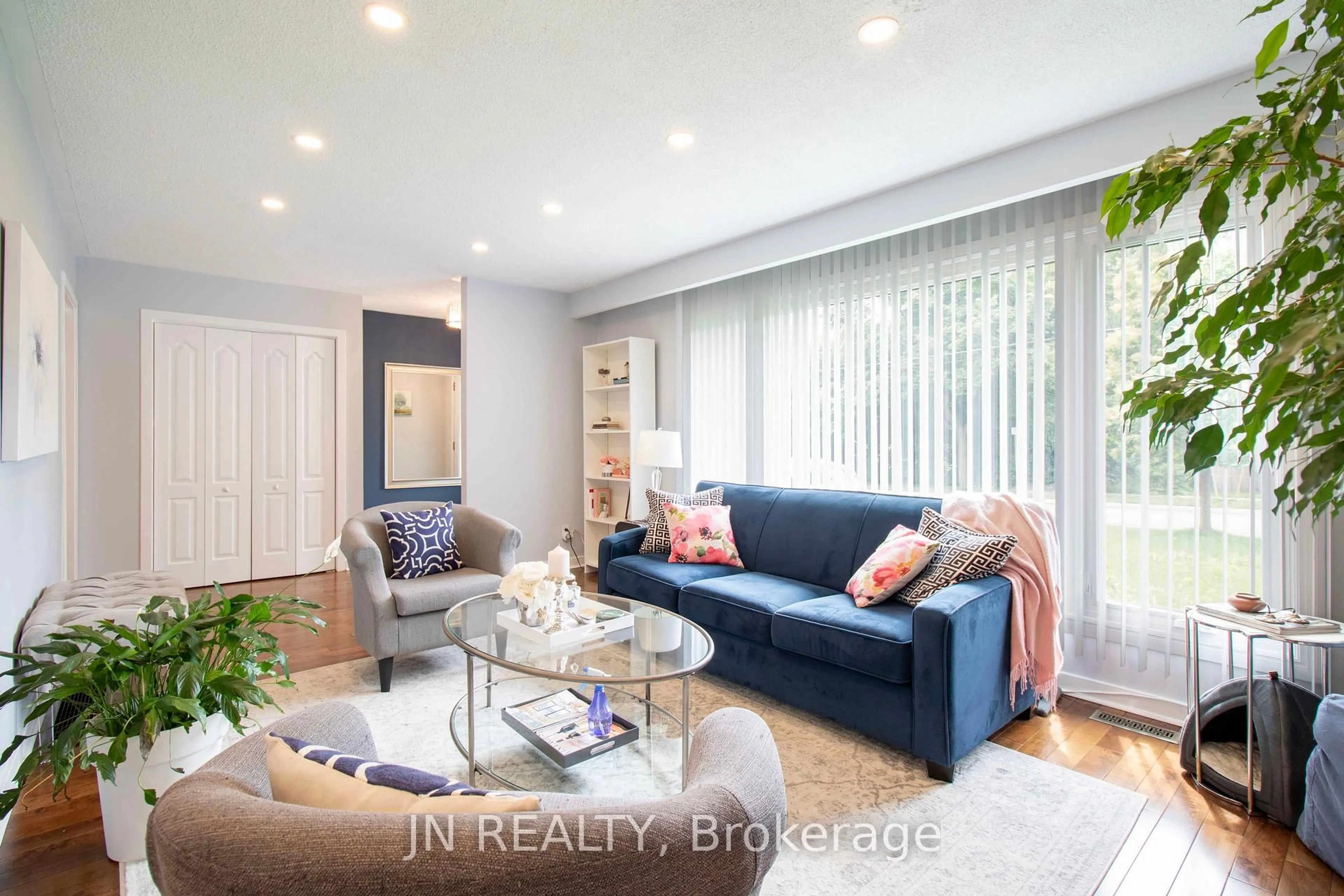 Living room with furniture, wood/laminate floor for 36 Harold St, Brampton Ontario L6Y 1E2