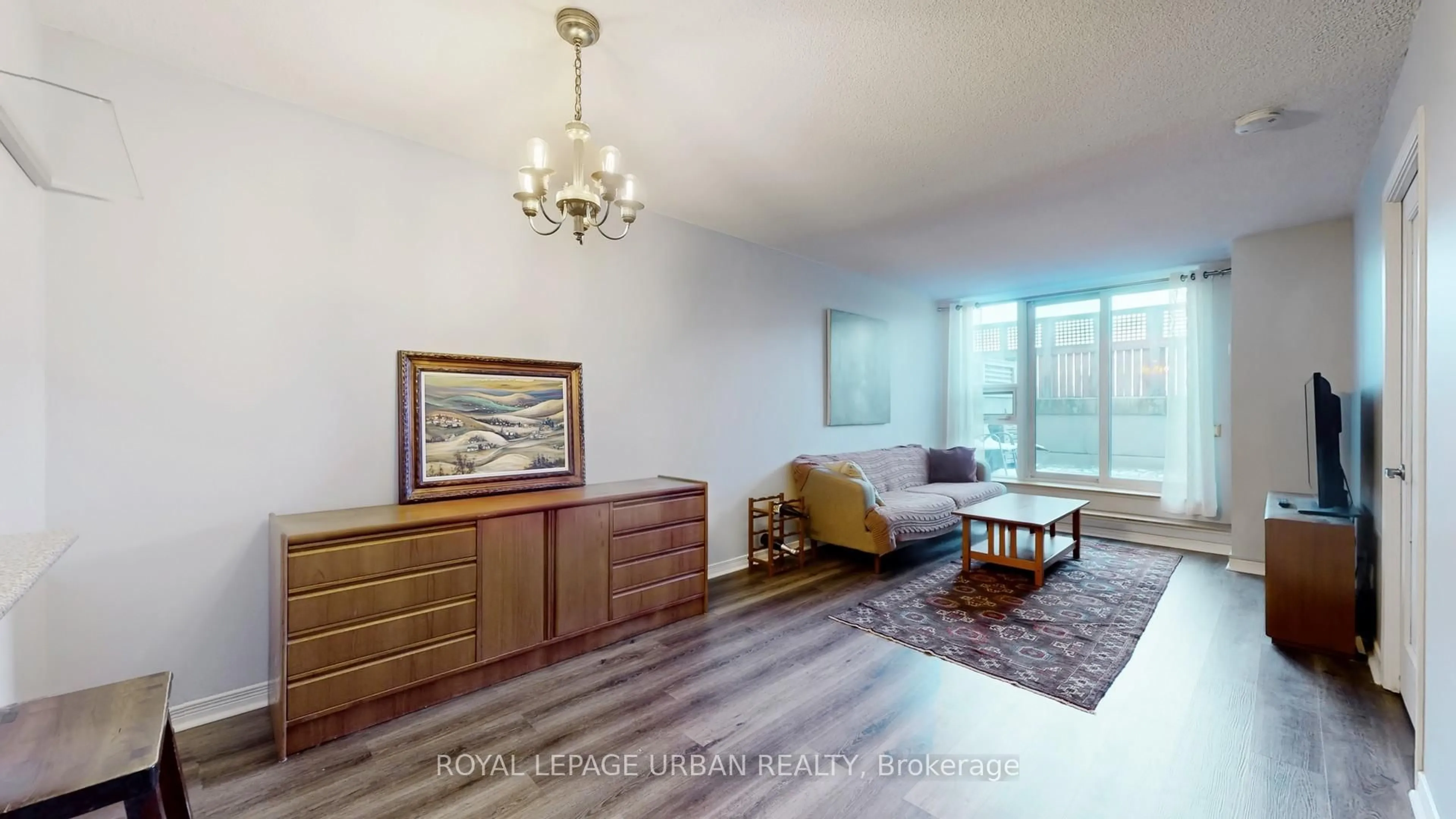 Living room with furniture, wood/laminate floor for 60 Heintzman St #428, Toronto Ontario M6P 5A1