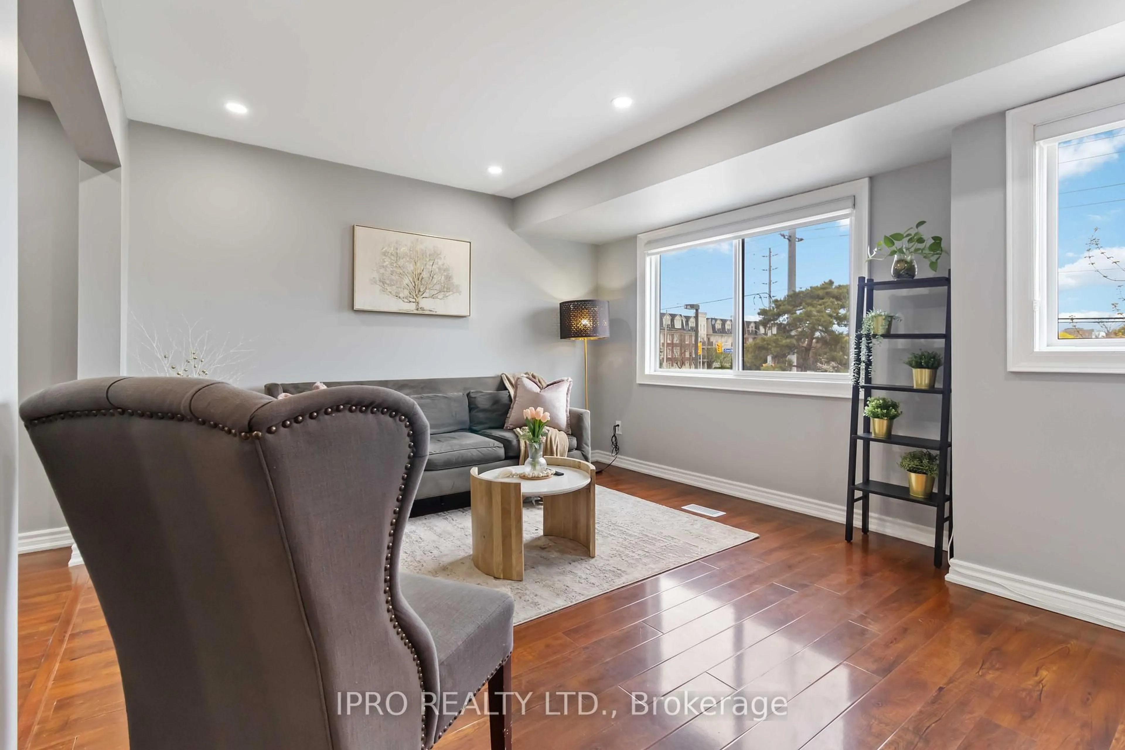 Living room with furniture, wood/laminate floor for 3345 Silverado Dr #64, Mississauga Ontario L5A 3Y8