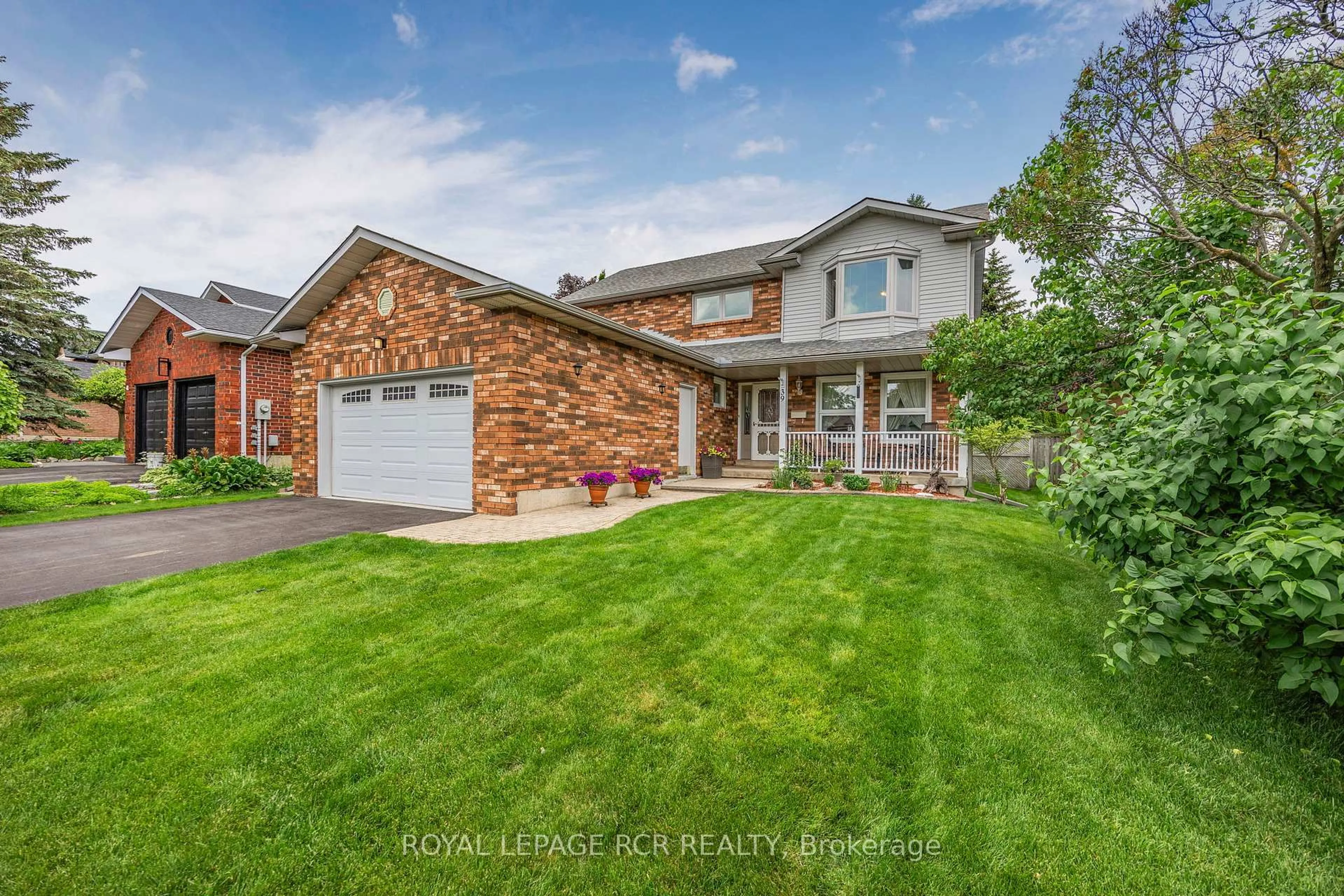 Home with brick exterior material, street for 39 Passmore Ave, Orangeville Ontario L9W 4K4