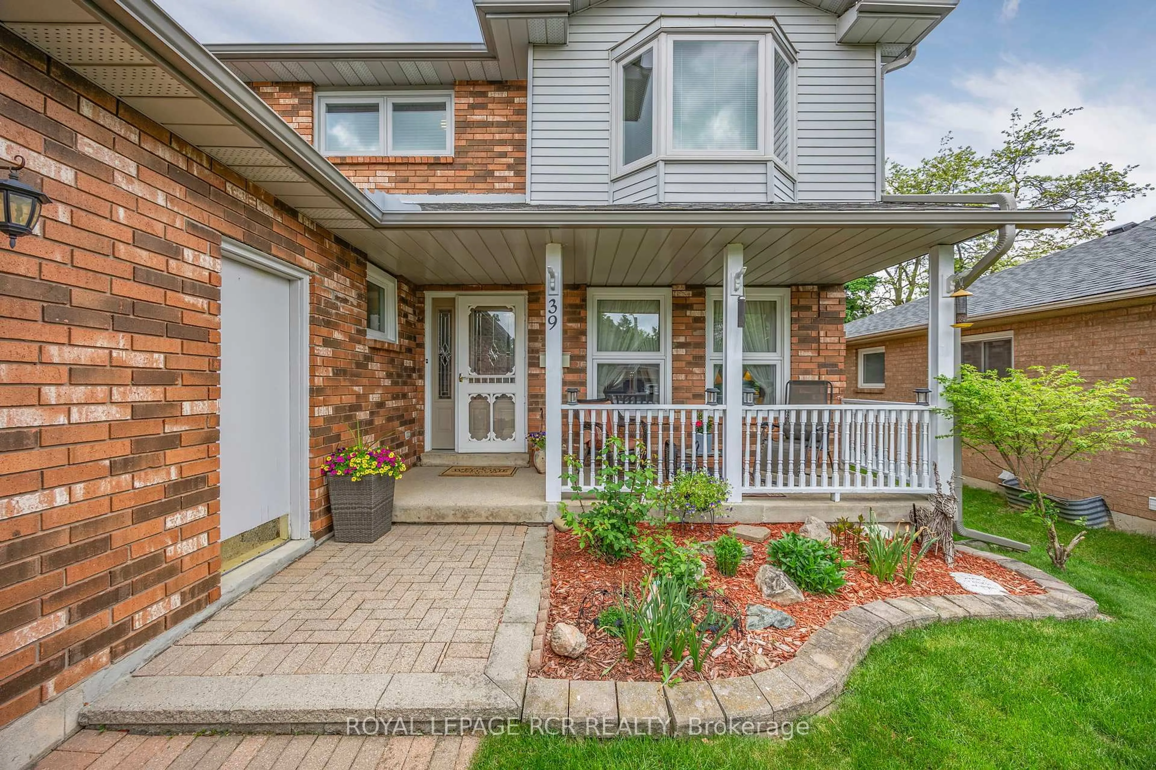 Home with brick exterior material, street for 39 Passmore Ave, Orangeville Ontario L9W 4K4