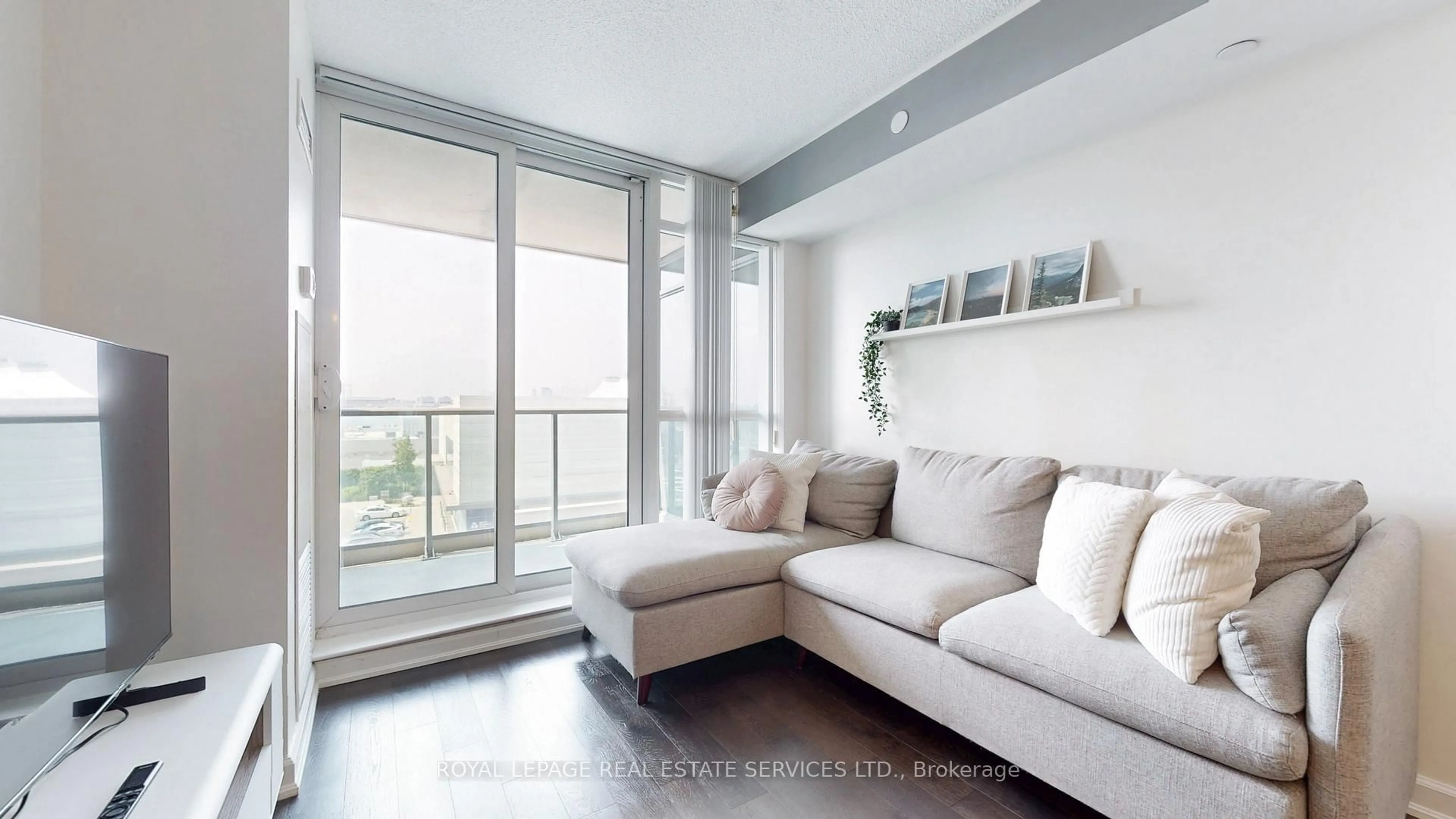 Living room with furniture, wood/laminate floor for 205 Sherway Gardens Rd #504, Toronto Ontario M9C 0A5