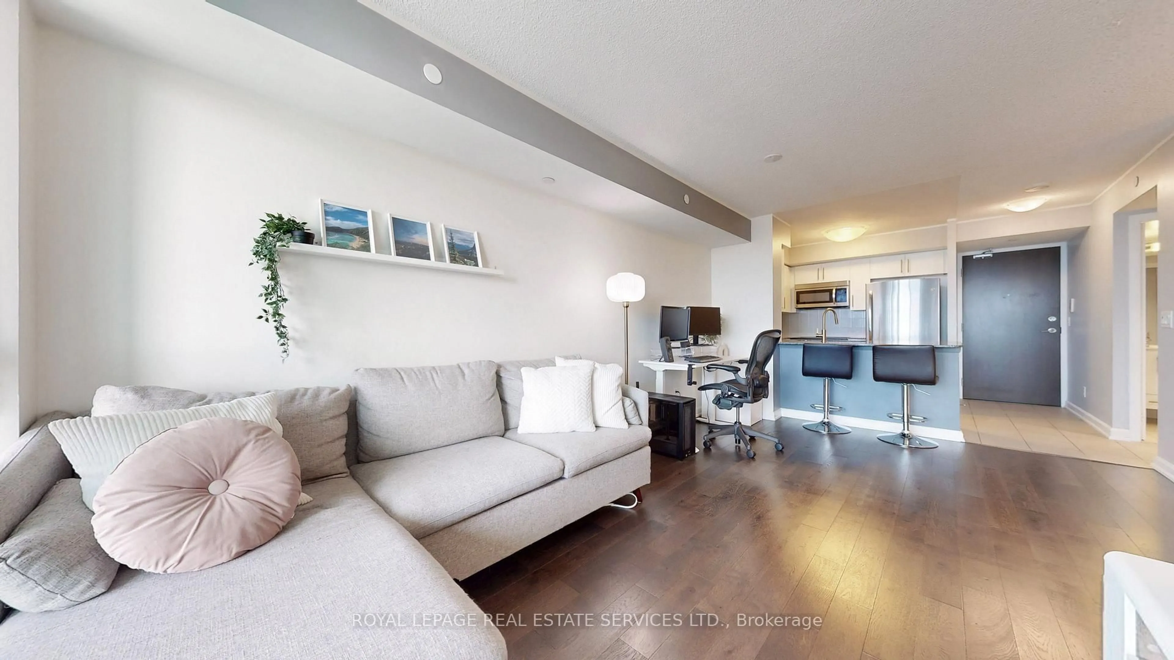 Living room with furniture, wood/laminate floor for 205 Sherway Gardens Rd #504, Toronto Ontario M9C 0A5