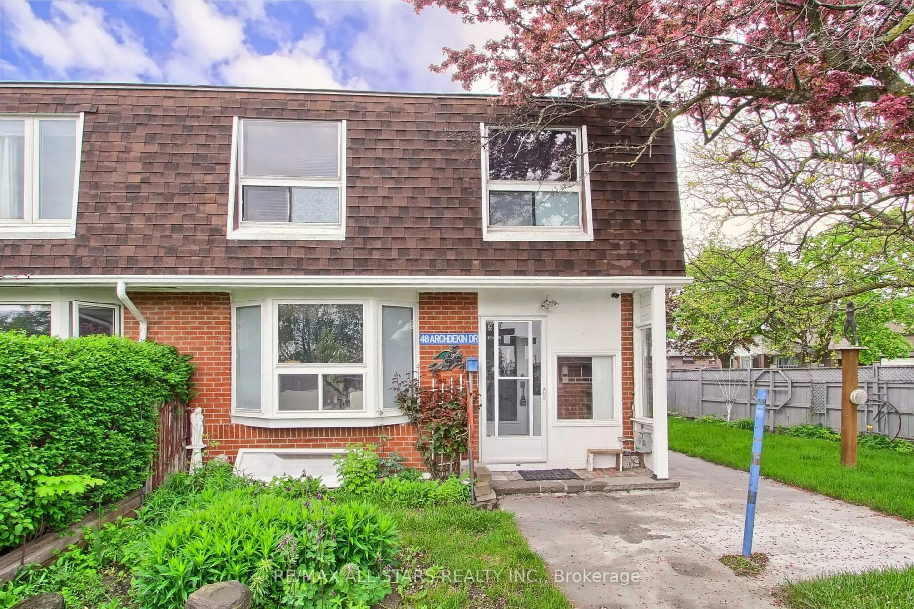 Home with brick exterior material, street for 48 Archdekin Dr, Brampton Ontario L6V 1Y4