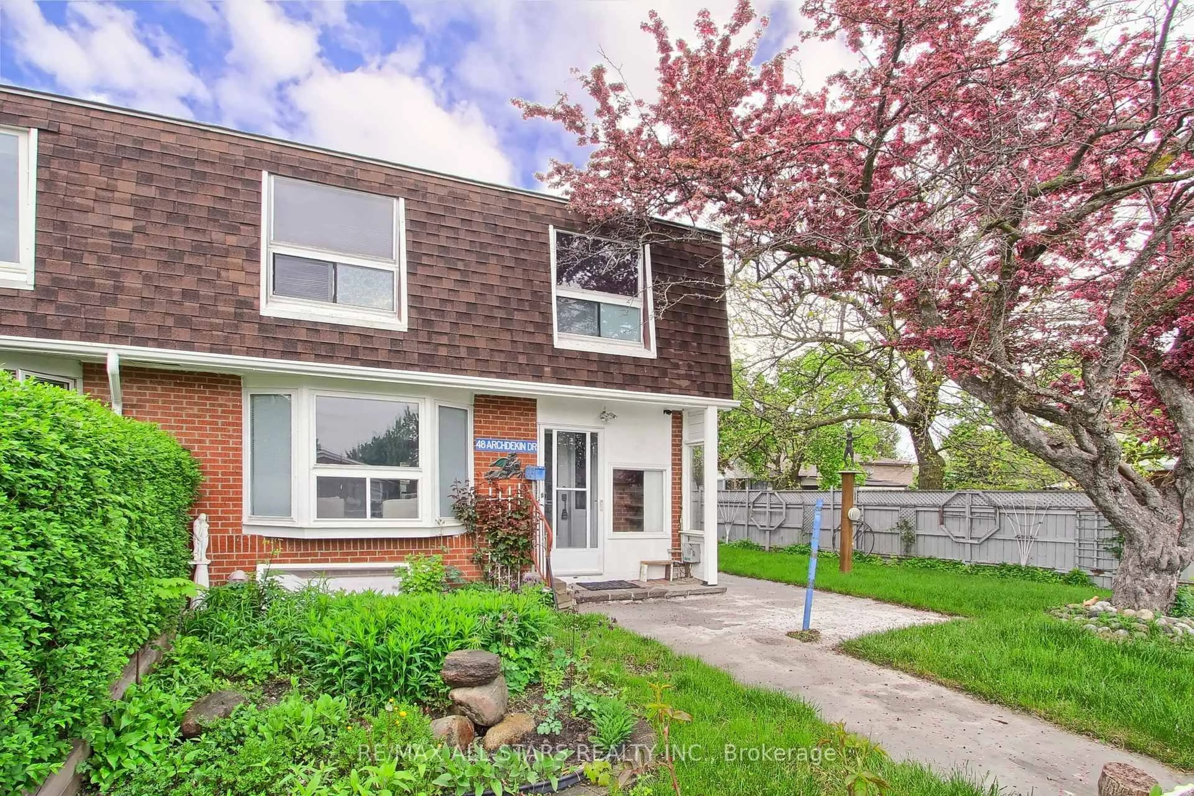 Home with vinyl exterior material, street for 48 Archdekin Dr, Brampton Ontario L6V 1Y4