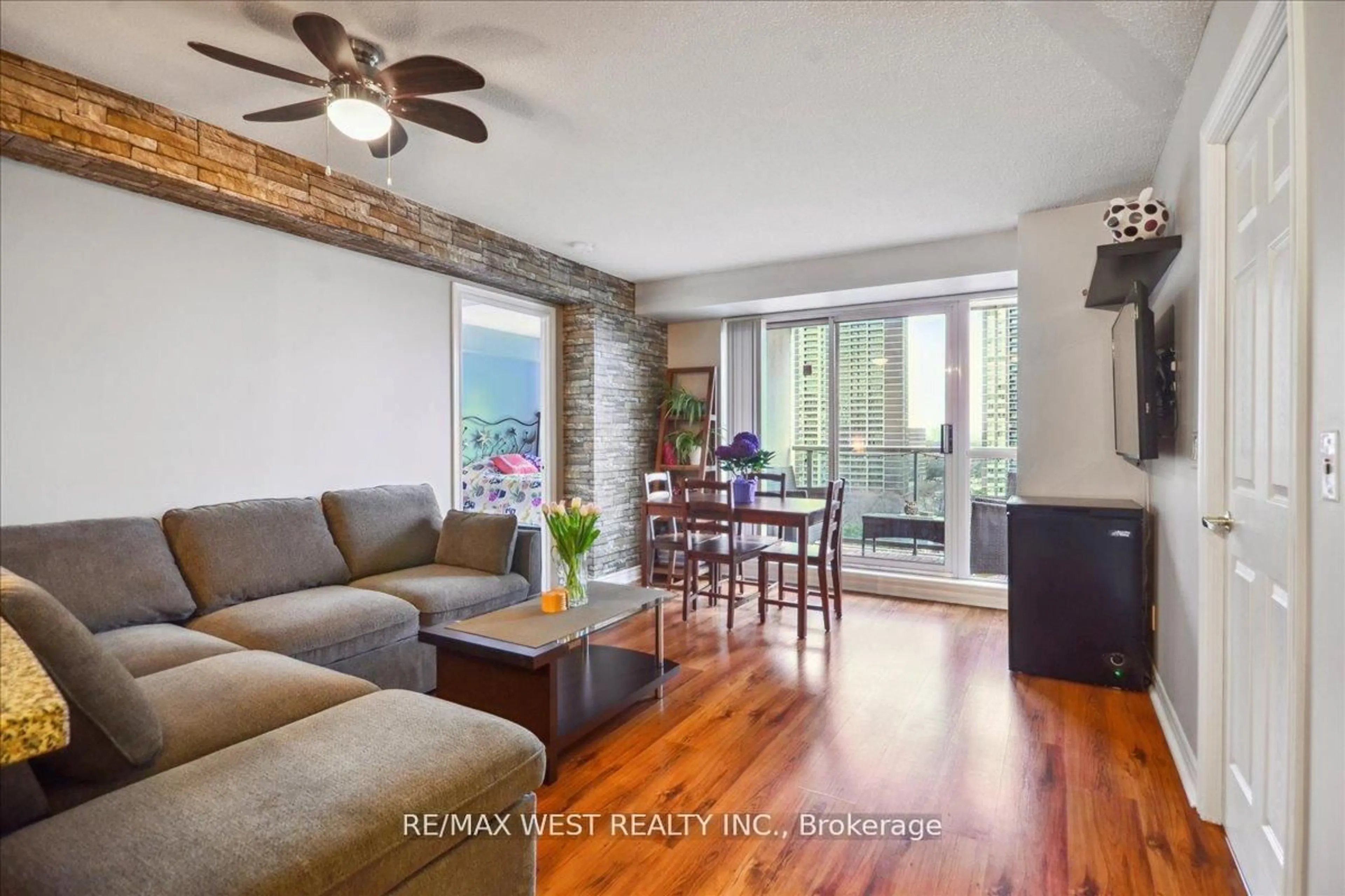 Living room with furniture, wood/laminate floor for 5 Michael Power Pl #902, Toronto Ontario M9A 0A3