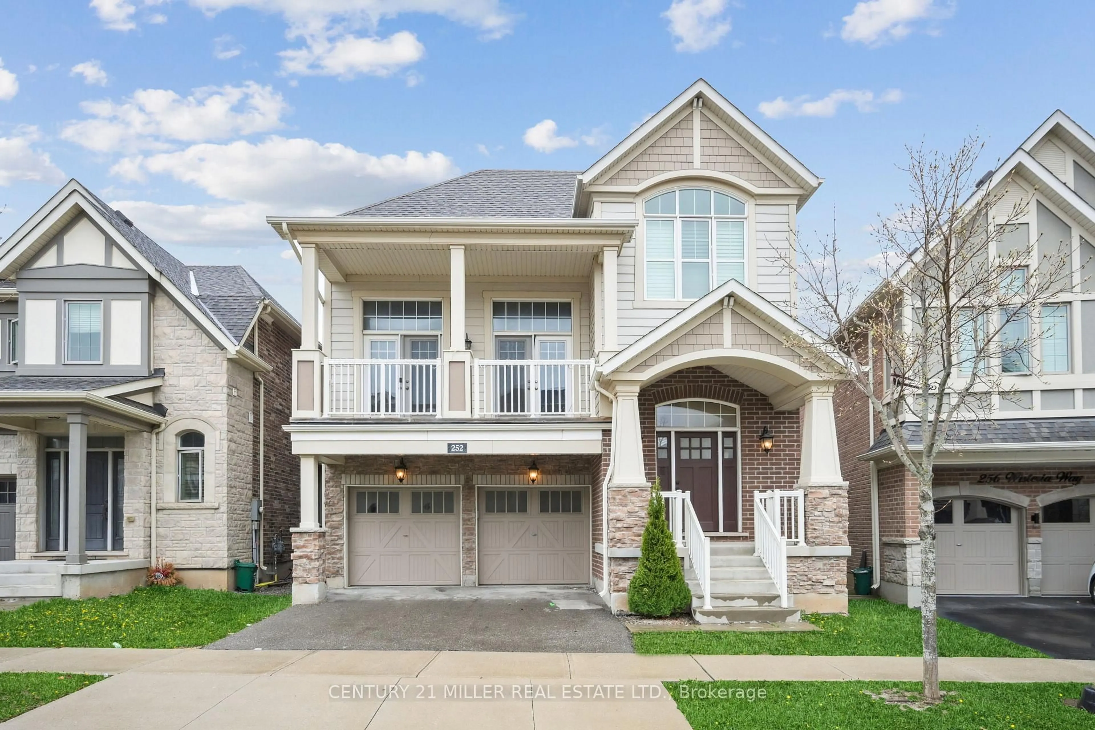 Home with brick exterior material, street for 252 Wisteria Way, Oakville Ontario L6M 1L3
