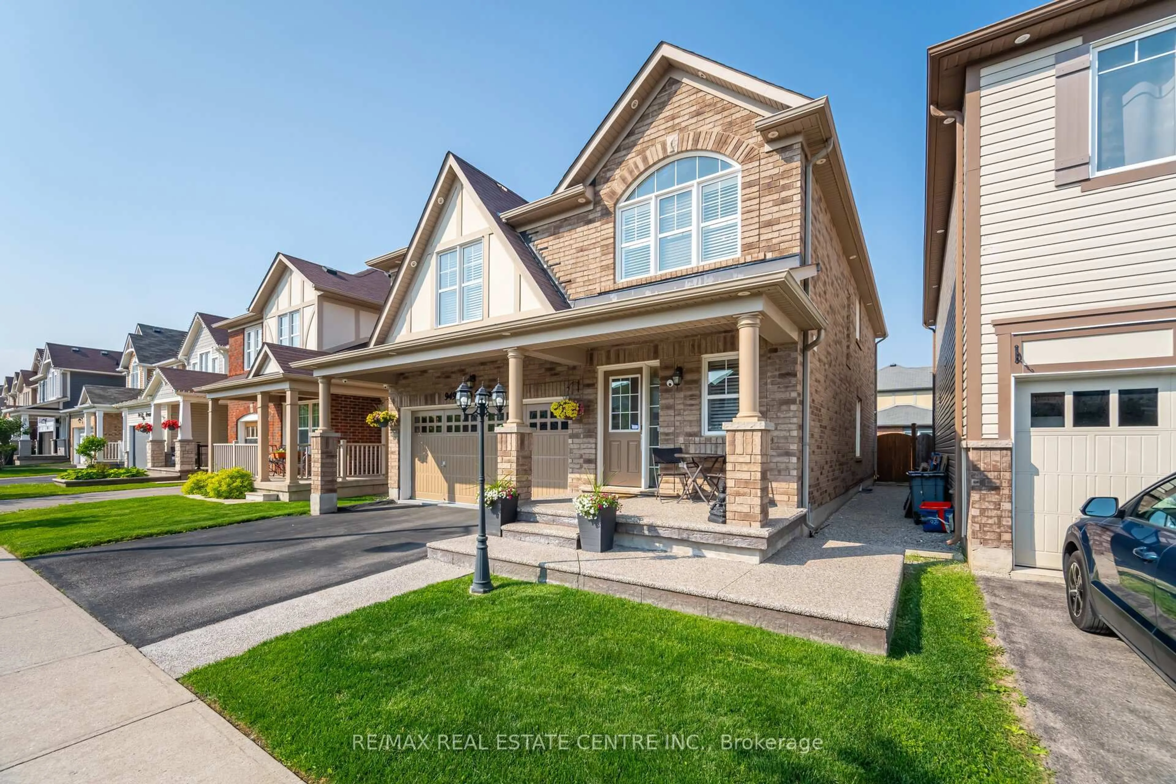 Home with brick exterior material, street for 949 Rigo Crossing, Milton Ontario L9T 8C5