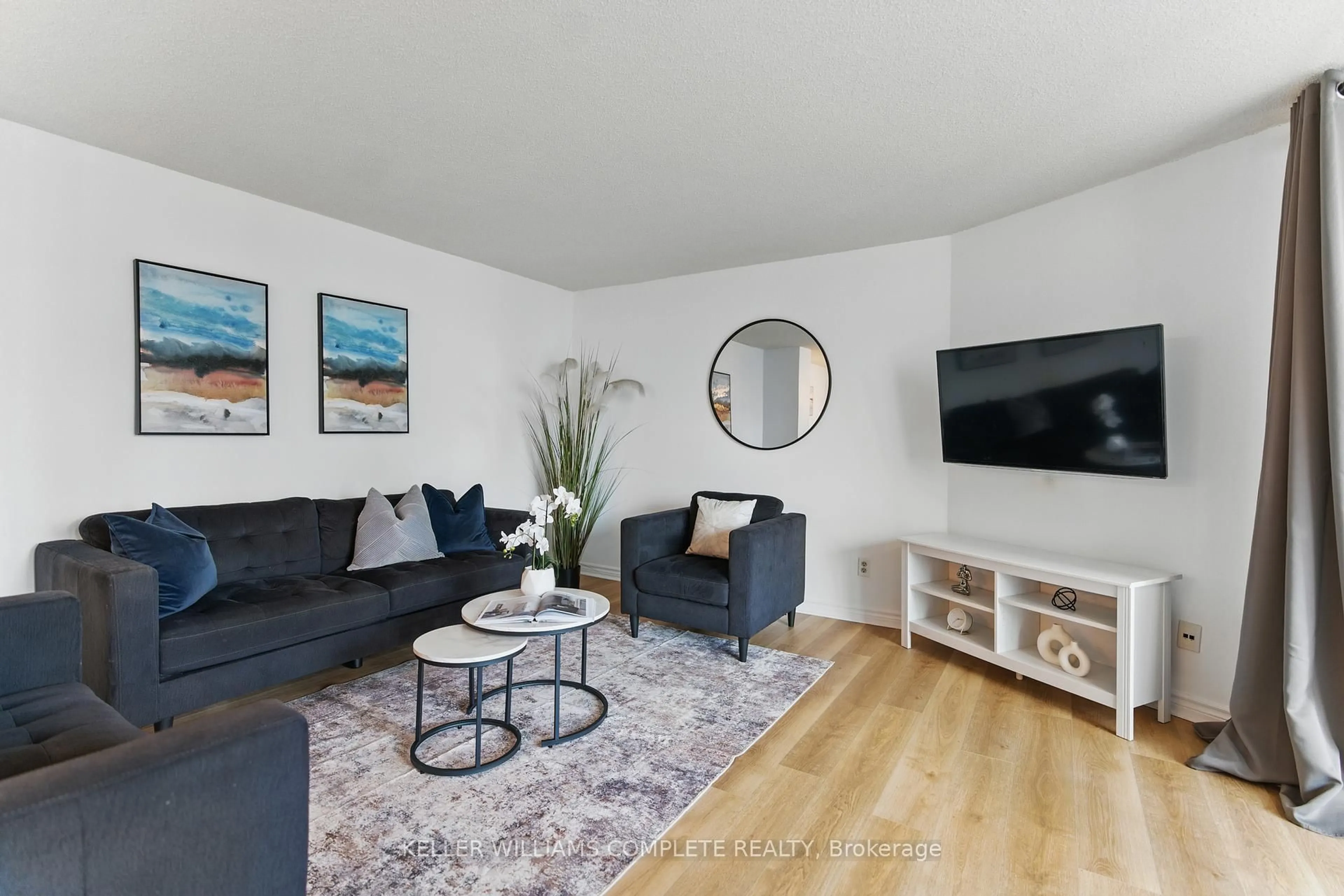 Living room with furniture, wood/laminate floor for 3700 KANEFF Cres #1205, Mississauga Ontario L5A 4B8