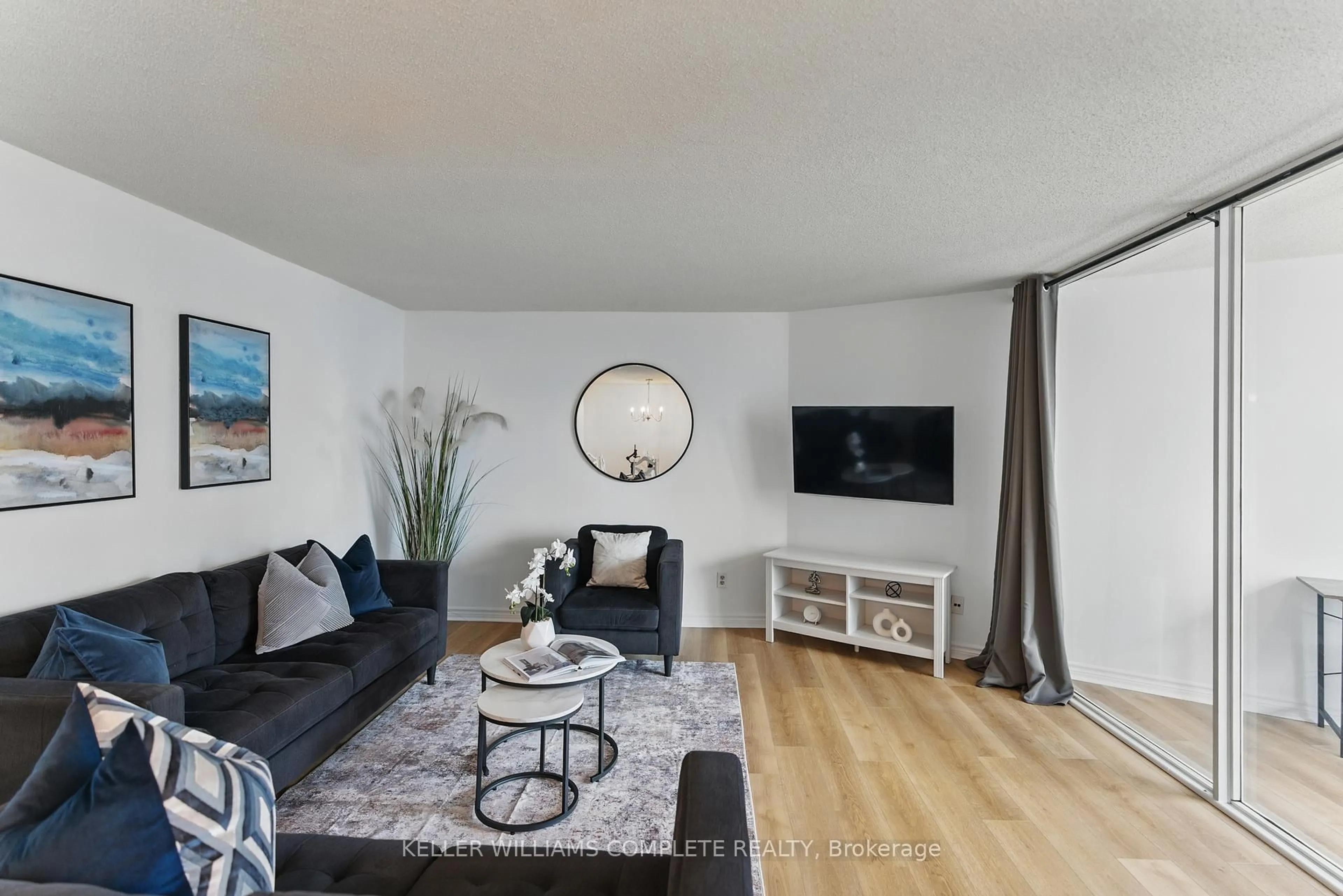 Living room with furniture, wood/laminate floor for 3700 KANEFF Cres #1205, Mississauga Ontario L5A 4B8