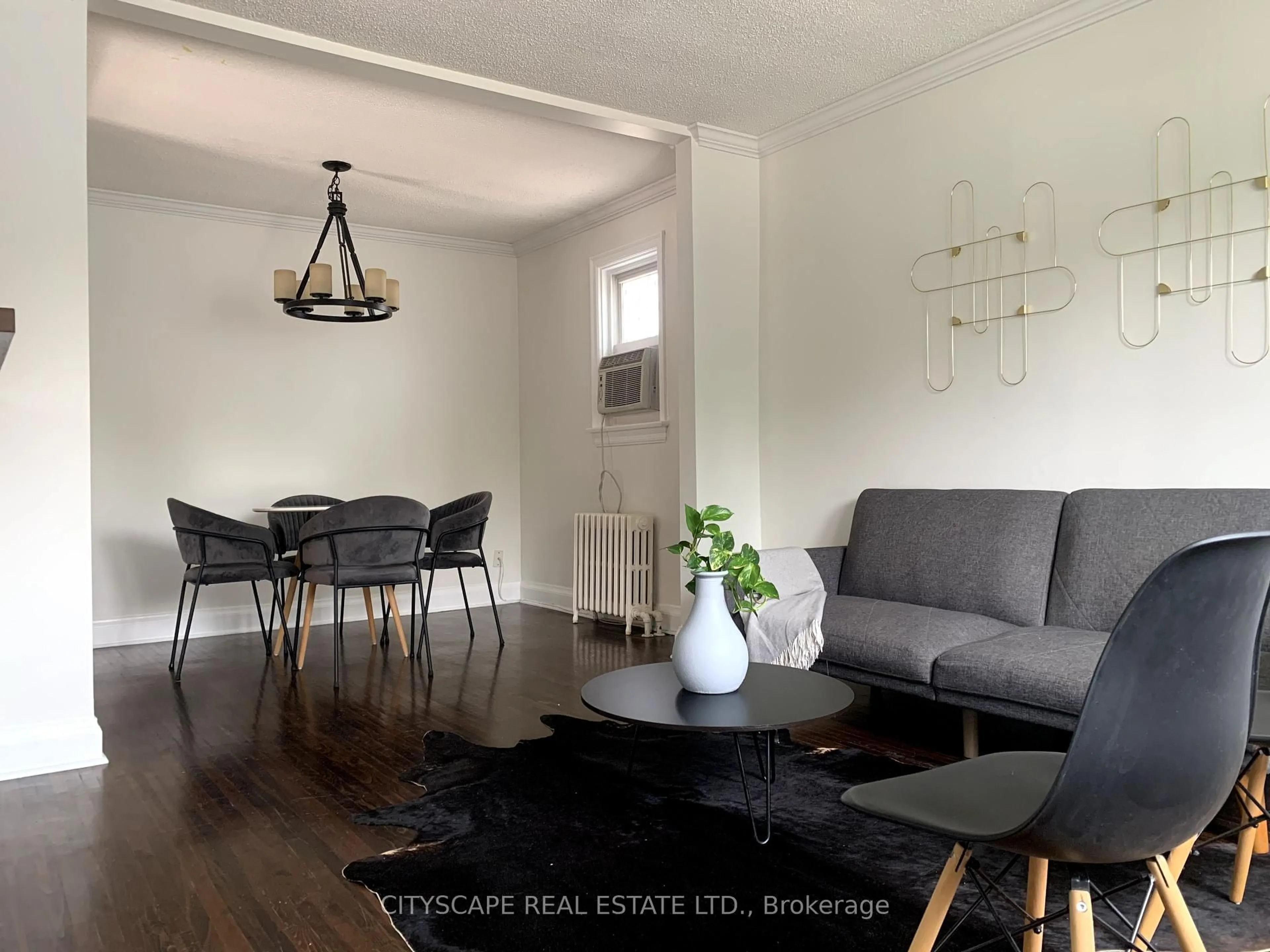 Living room with furniture, wood/laminate floor for 50 Stephen Dr, Toronto Ontario M8Y 3M6