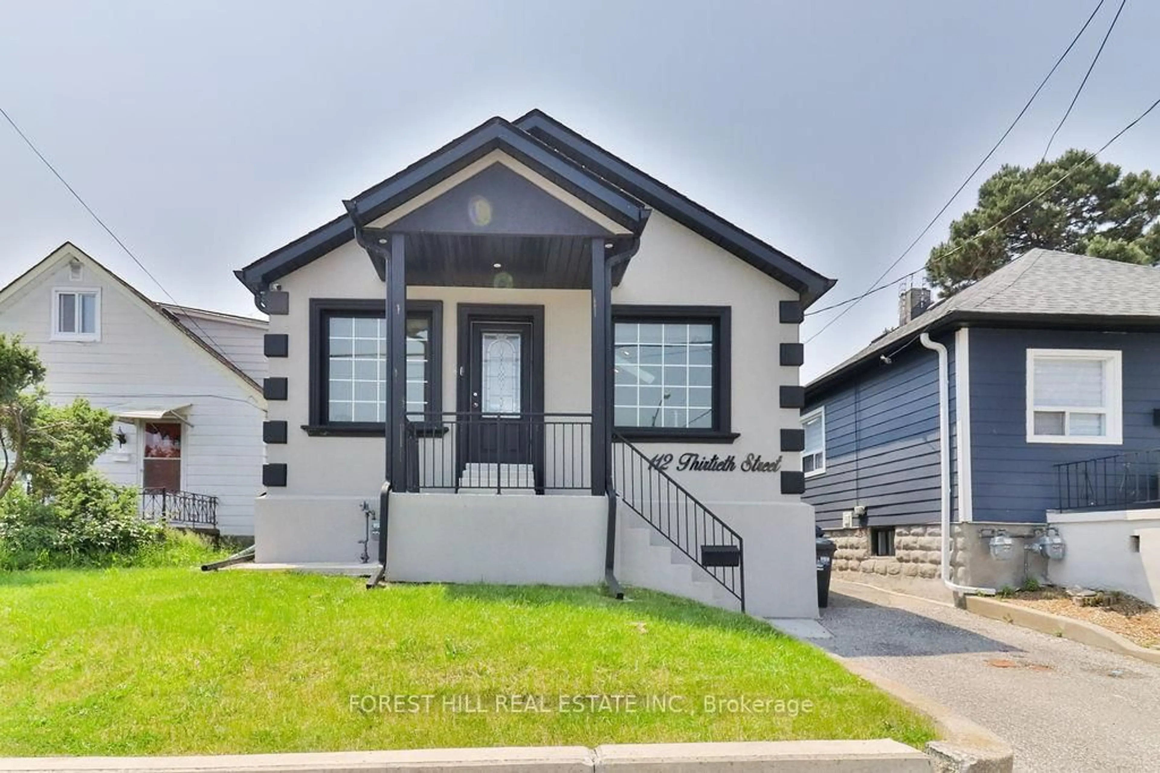 Home with vinyl exterior material, street for 112 Thirtieth St, Toronto Ontario M8W 3B8