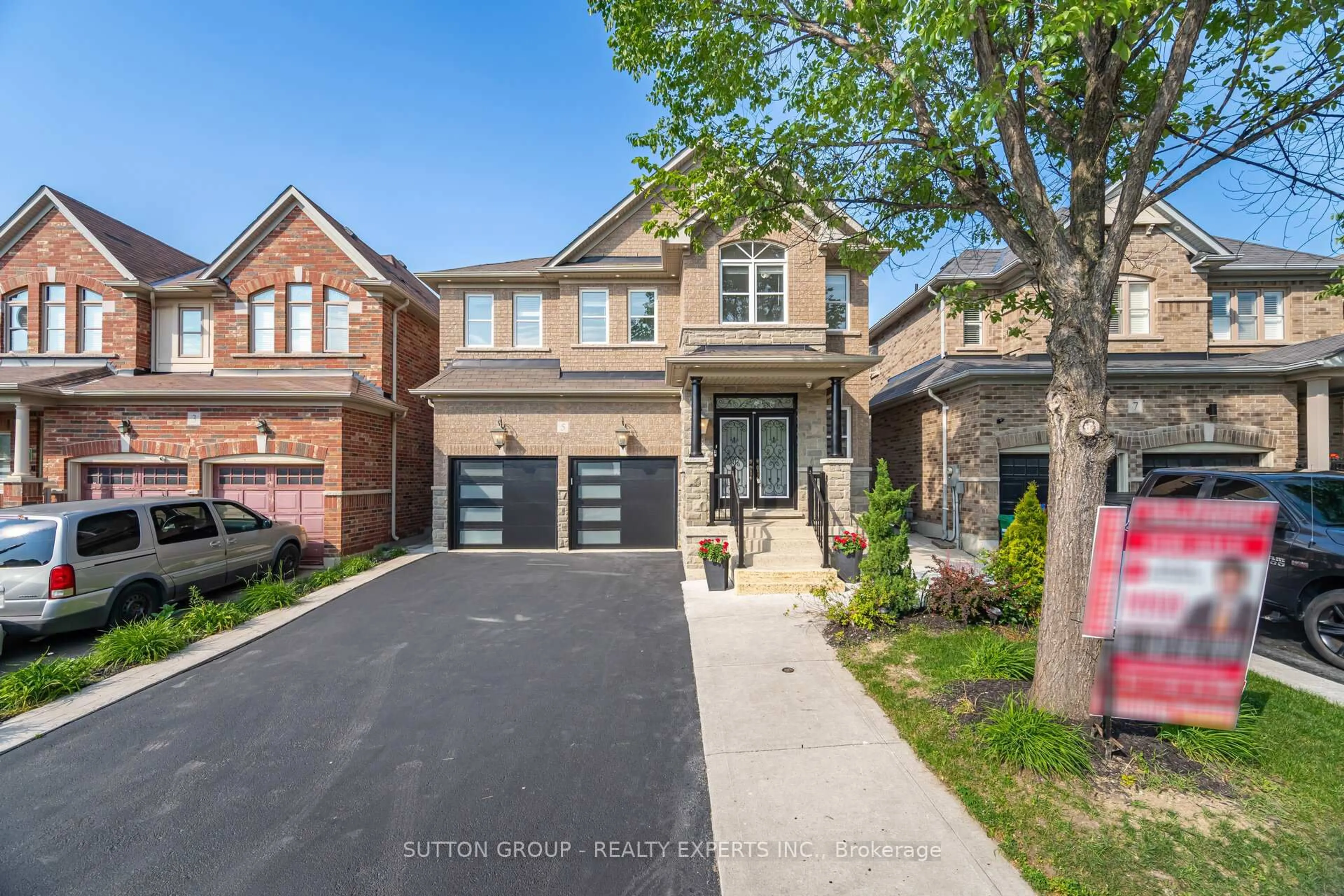 Home with brick exterior material, street for 5 Freedom Oaks Tr, Brampton Ontario L6P 3L1
