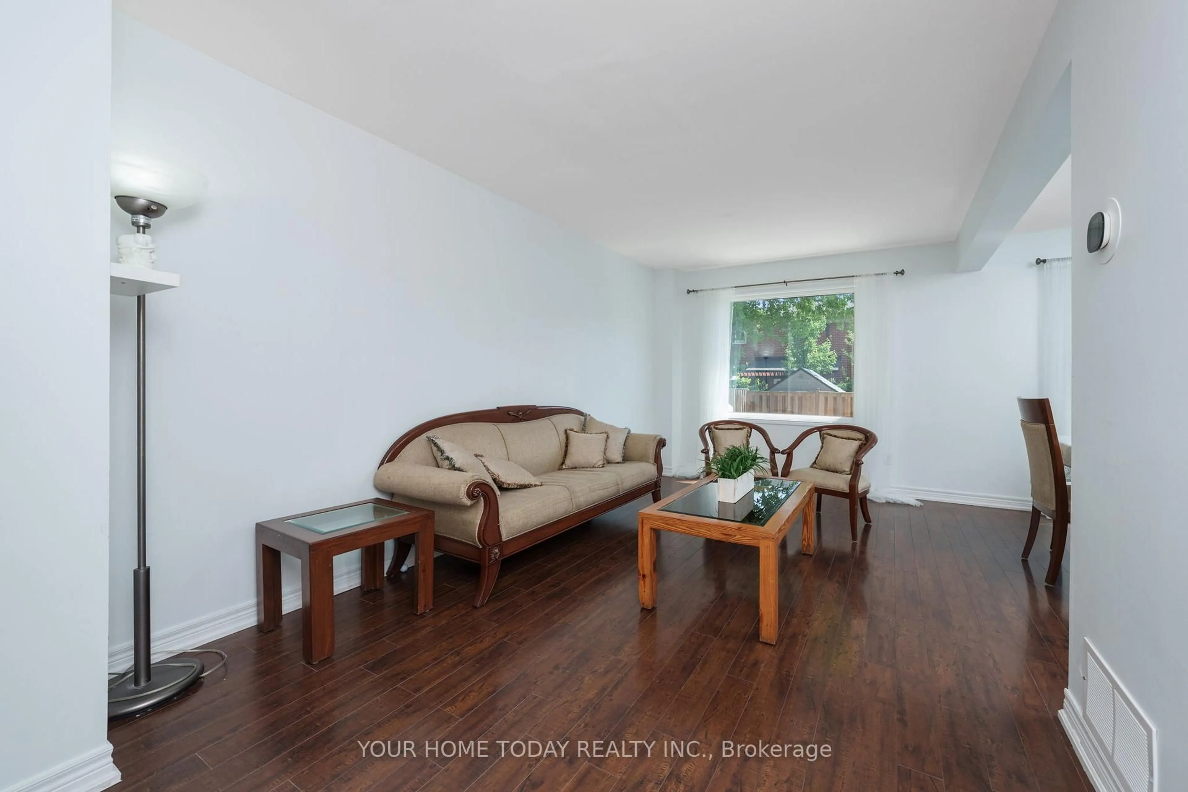 Living room with furniture, wood/laminate floor for 18 Alabaster Dr, Brampton Ontario L6V 4E4